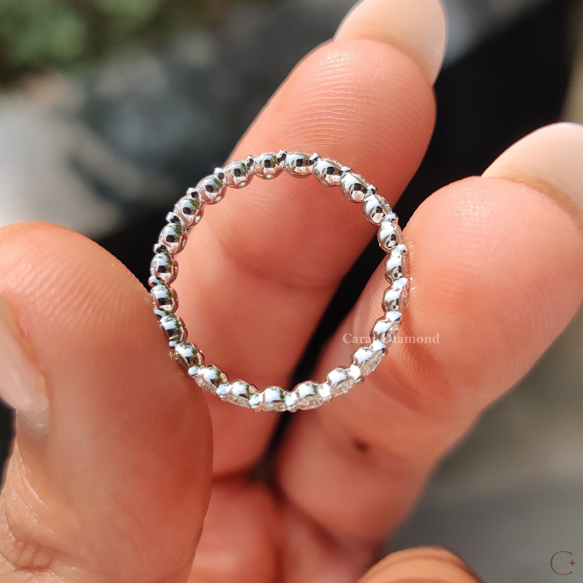 Custom white gold wedding band with round diamonds.
