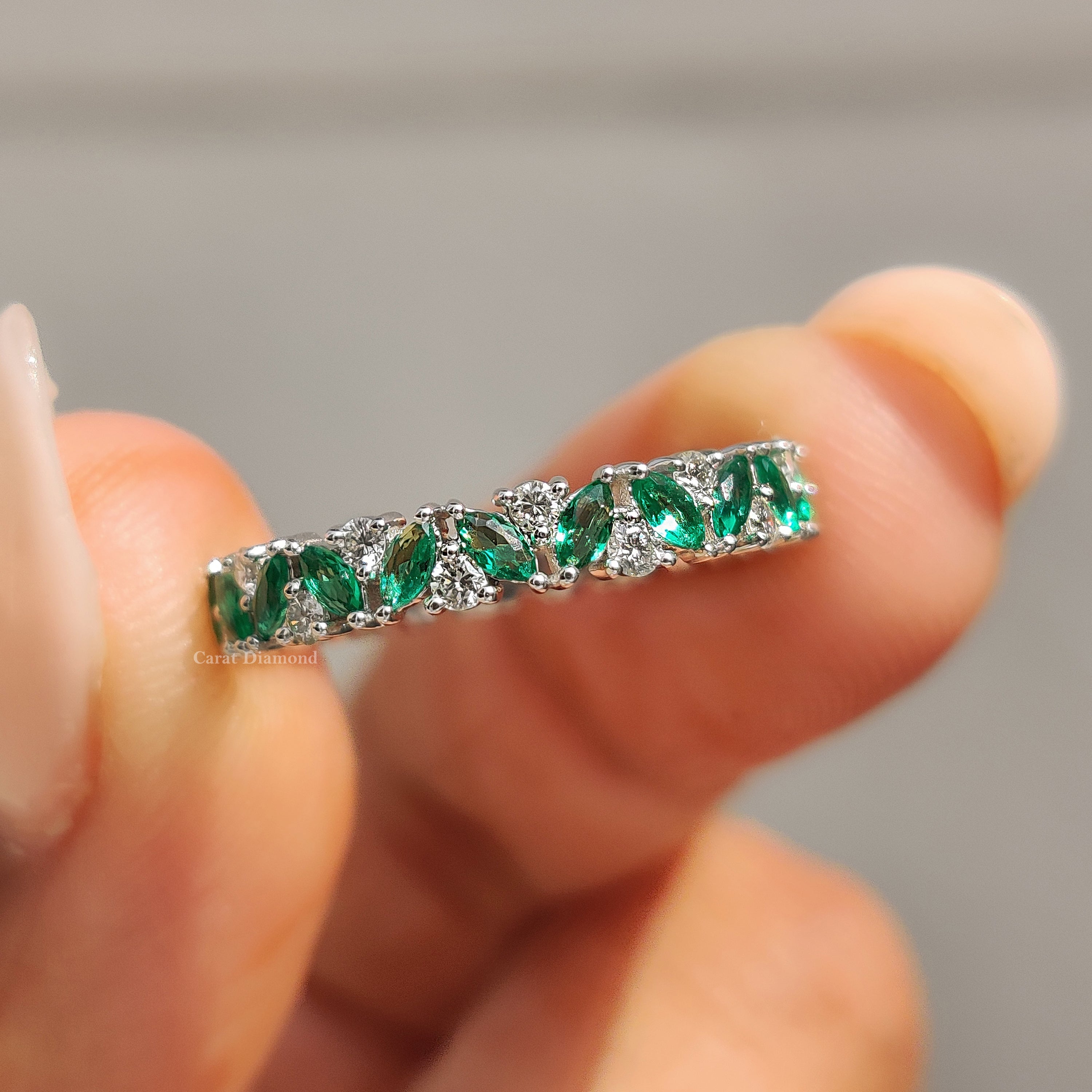 Zig zag wedding band featuring marquise and round diamonds.
