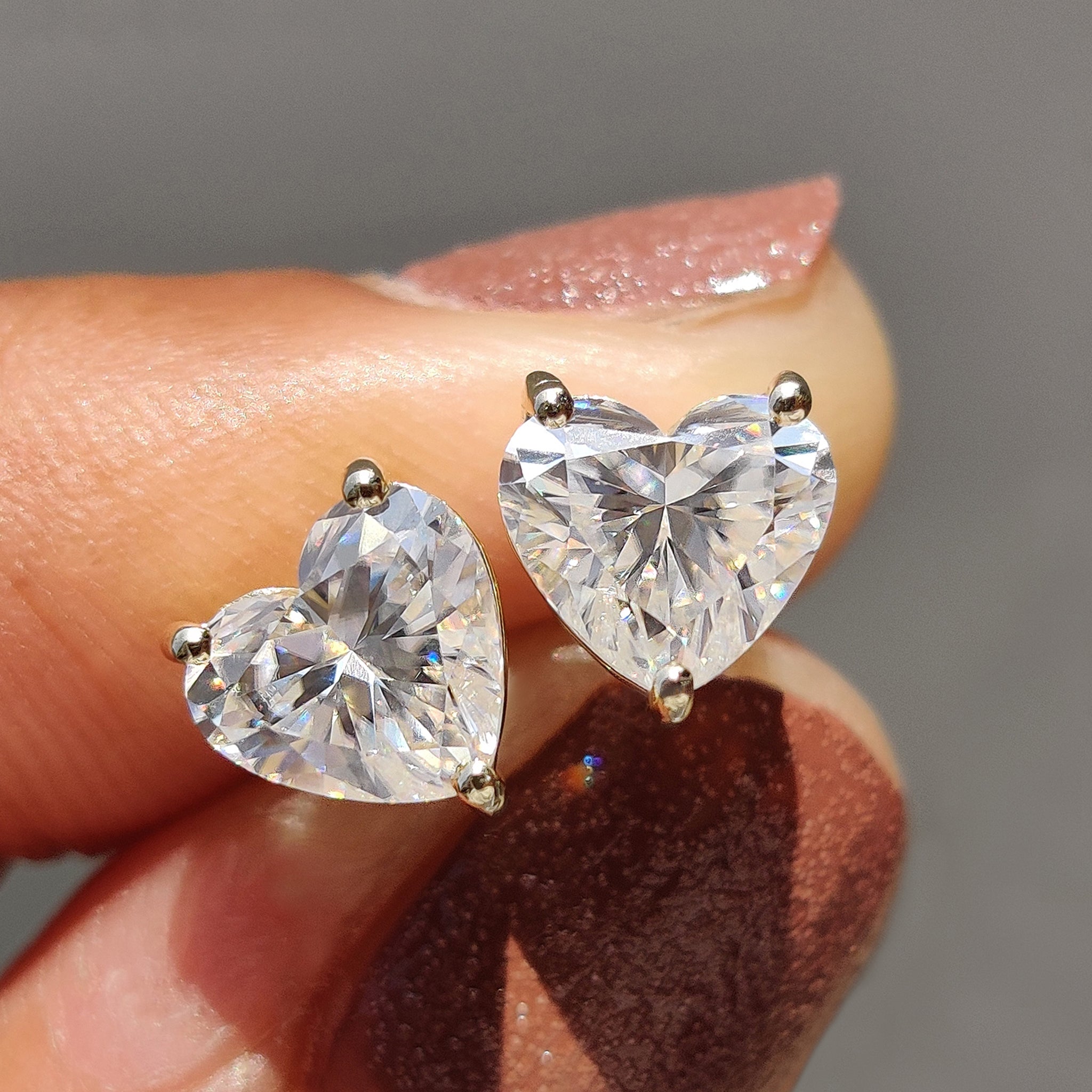 Heart Cut Moissanite Earrings made in white gold stud earrings with 3 prong earring settings.
