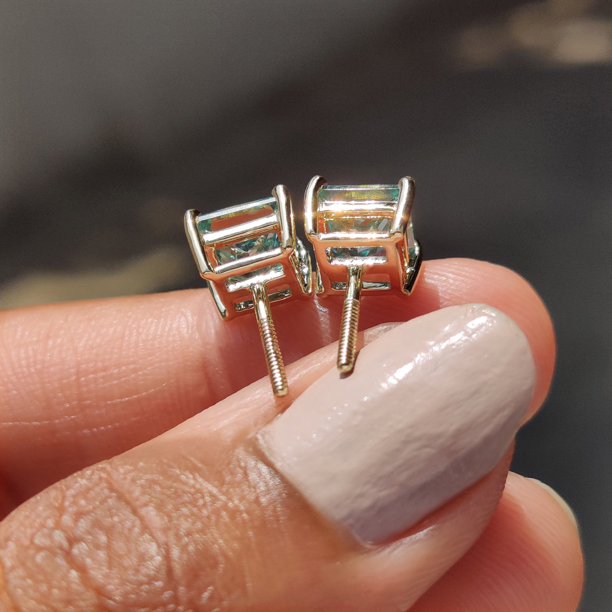 Moissanite Stud earrings made using Cyan Blue Princess Cut Moissanite earrings in a stud format.
