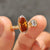 Toi et moi ring placed on marble surface
