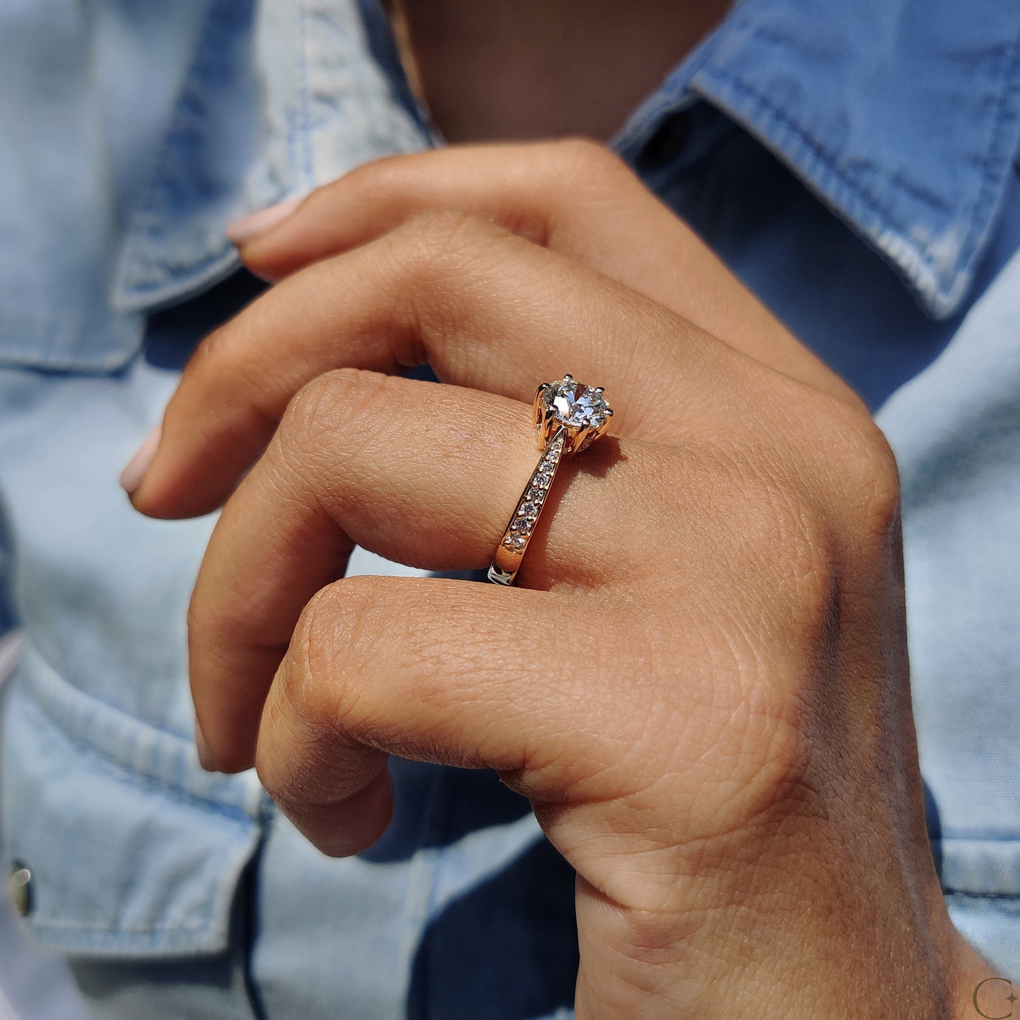 Carat Diamonds engagement ring with a brilliant pave setting.
