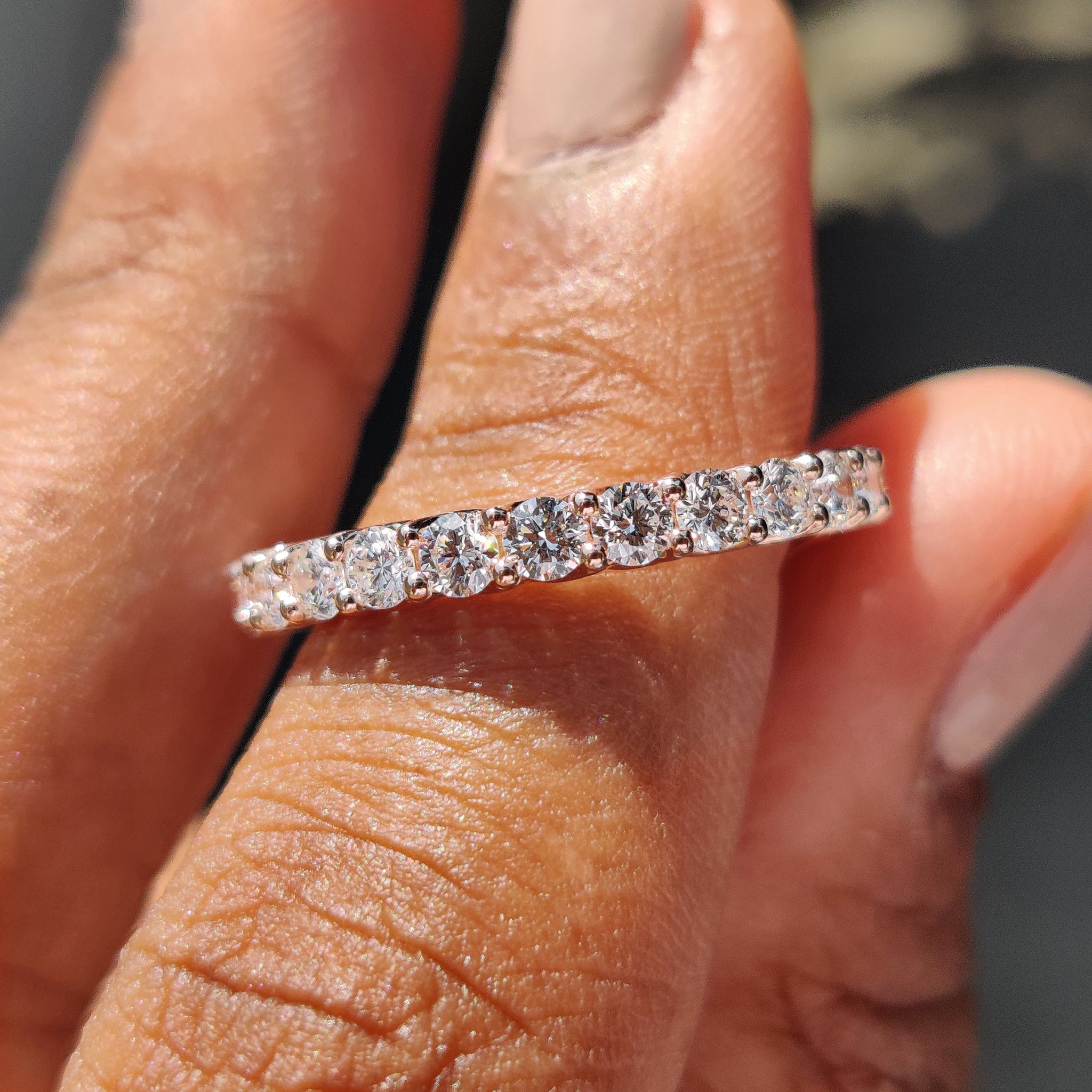 Rose gold wedding band featuring round cut diamonds
