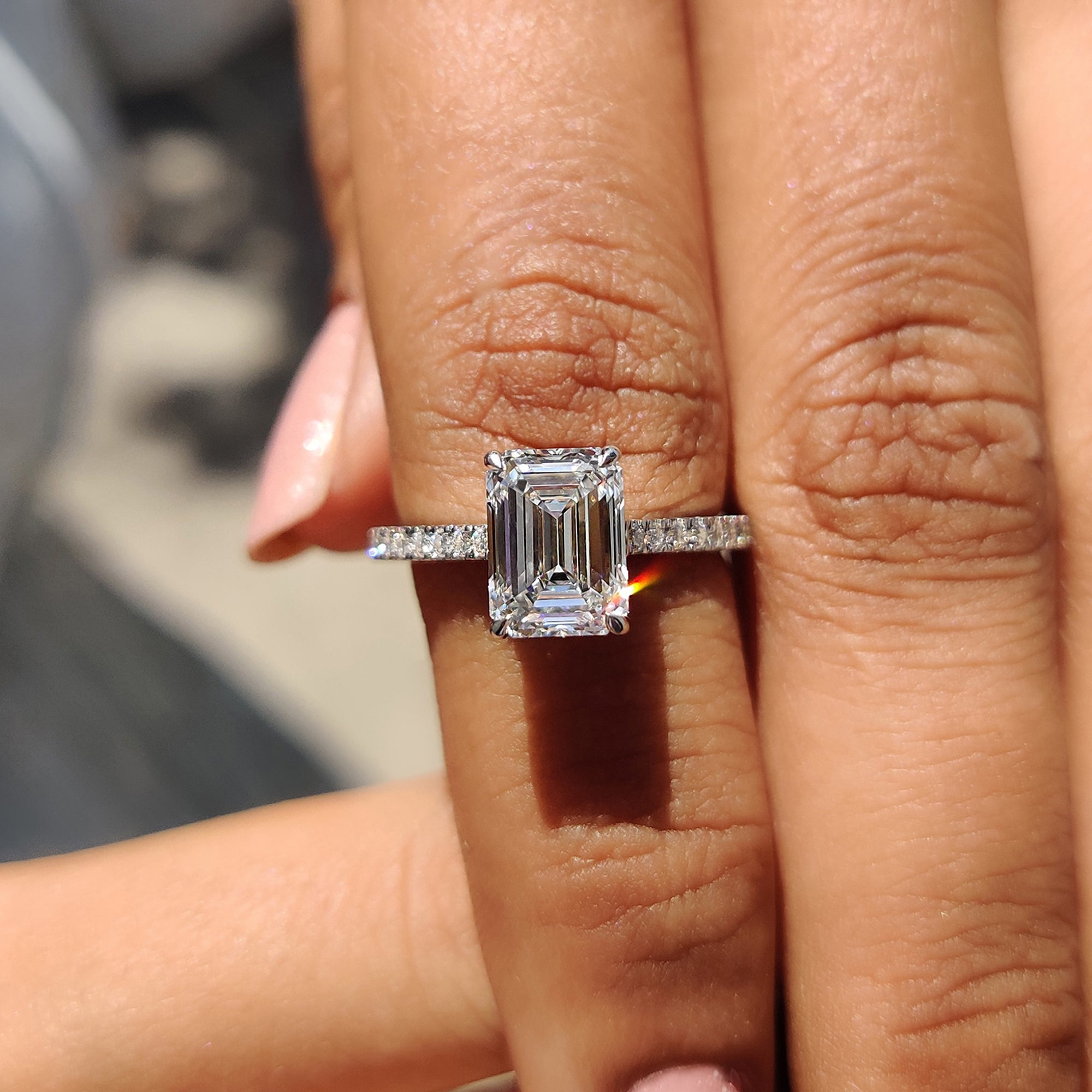 Carat Diamonds ring featuring a radiant emerald cut diamond.
