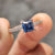 Princess cut moissanite ring with pave setting.
