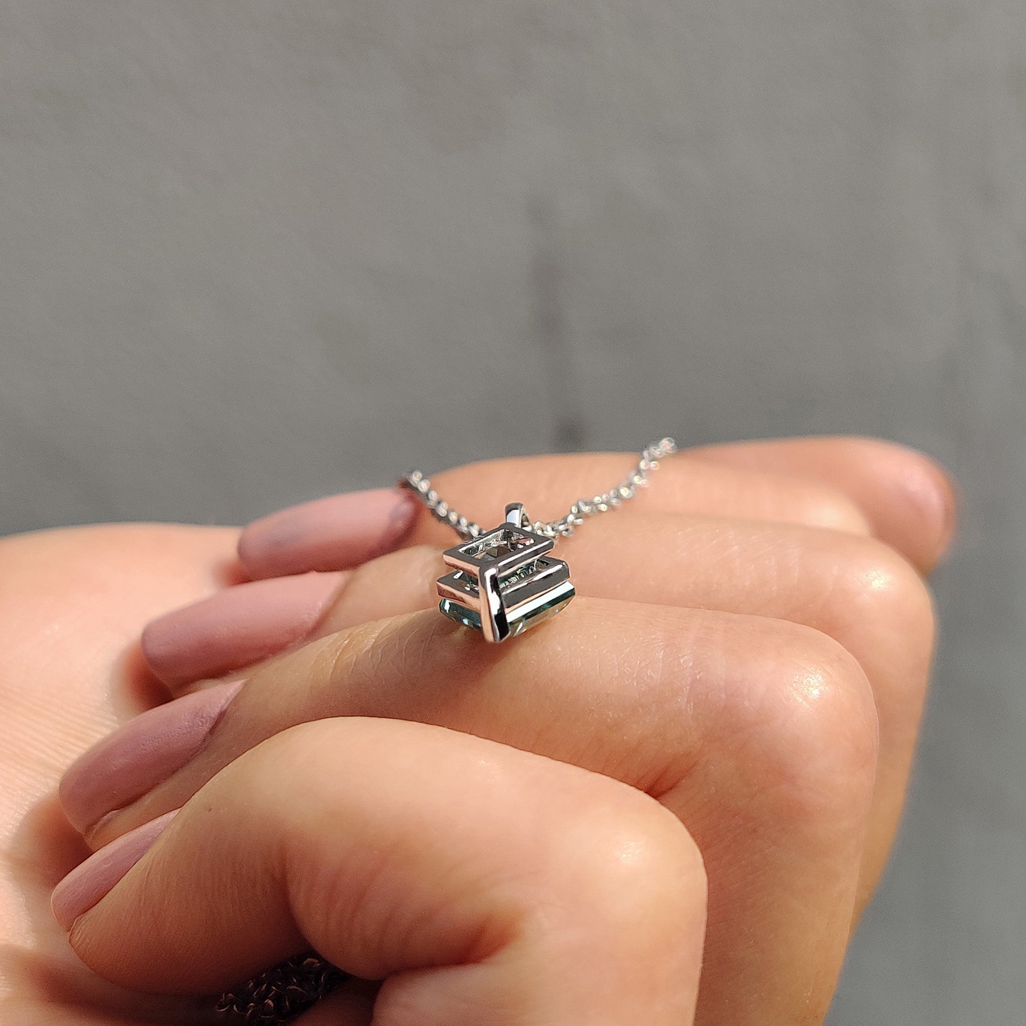 Pendant for women designed with lozenge cut moissanite pendant and handmade jewelry.
