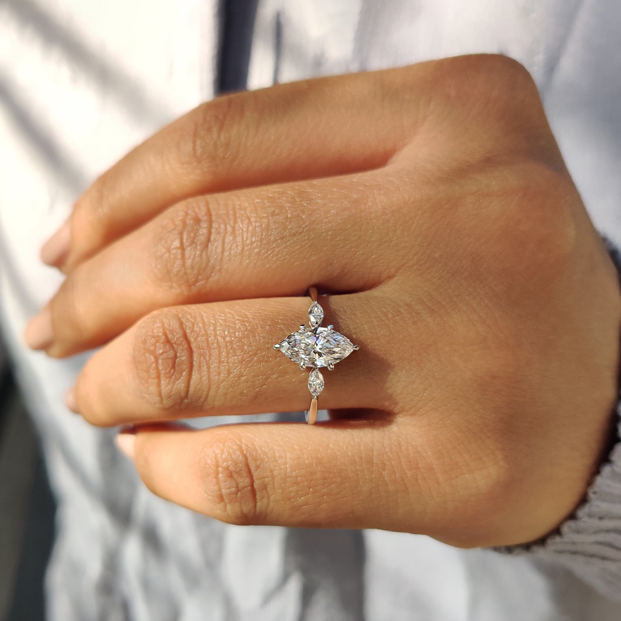 Engagement ring with marquise side stones for added sparkle.
