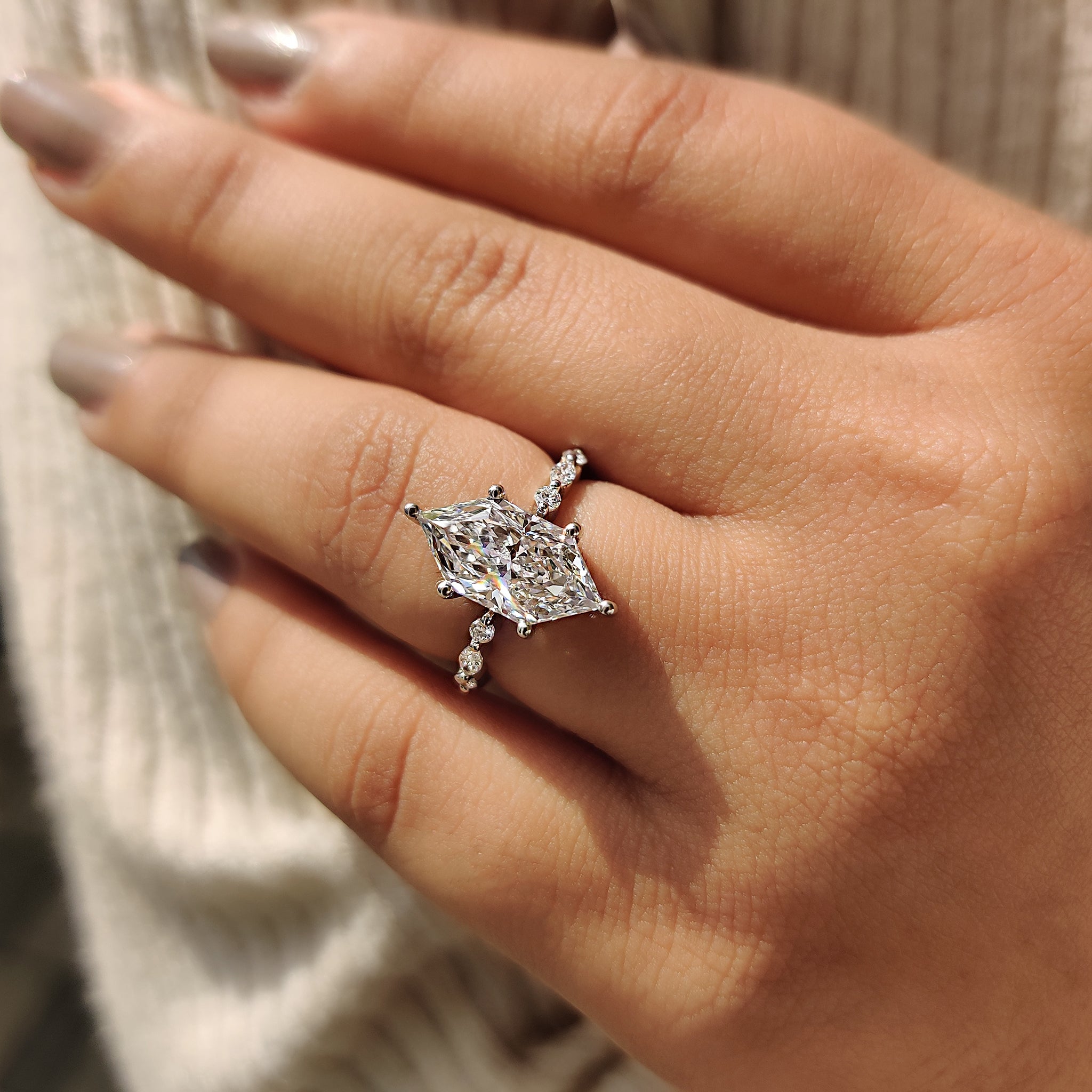 Handmade jewelry with marquise side stone.
