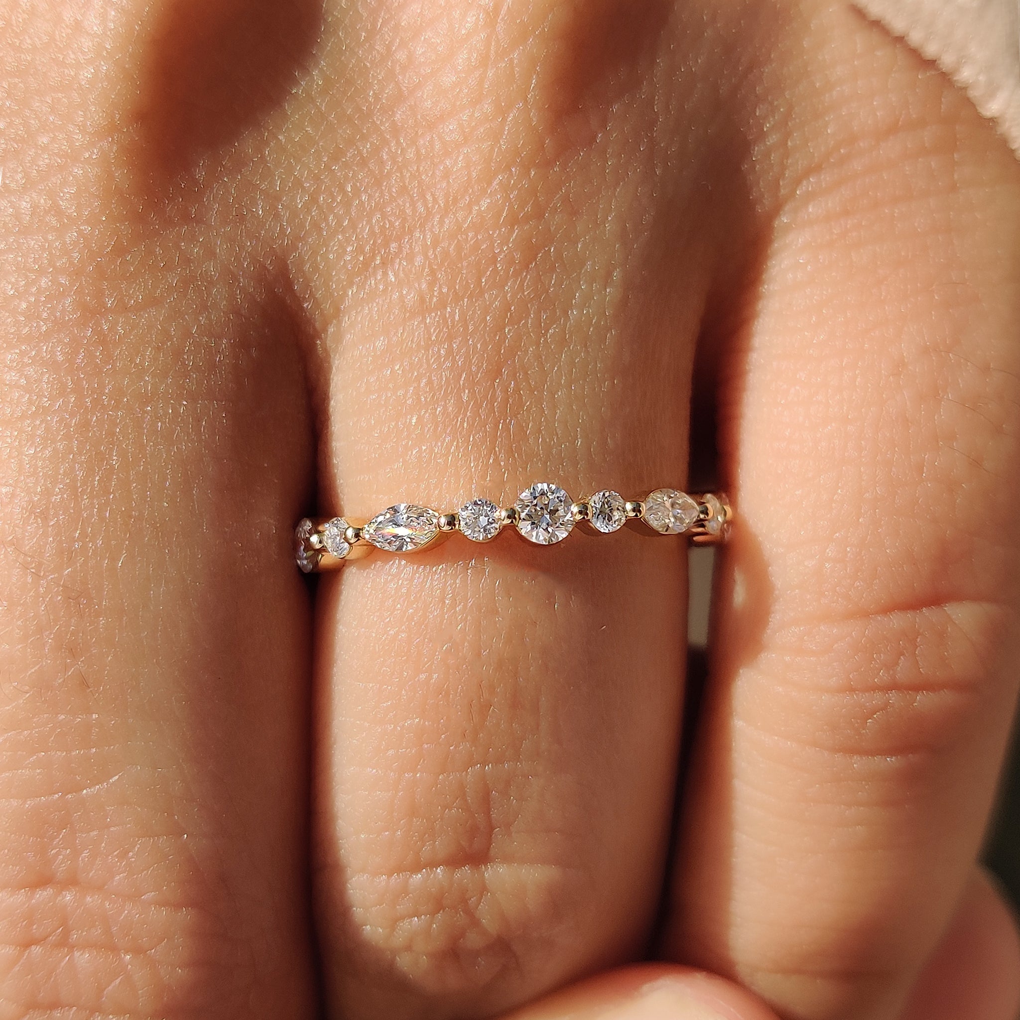 Yellow gold wedding band with marquise diamonds.
