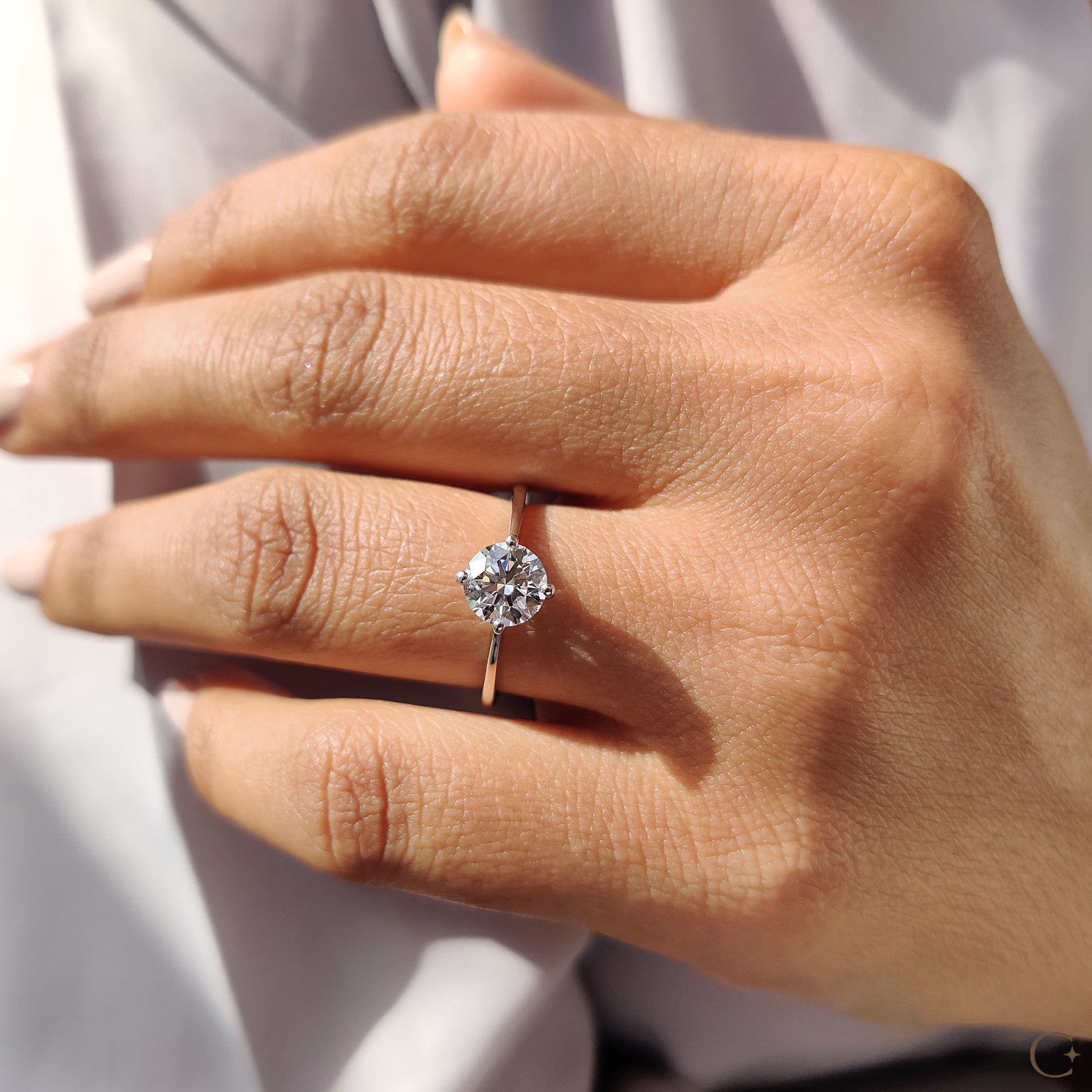 Compass prong engagement ring showcasing a stunning diamond.
