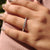 Half eternity wedding band with round diamond.