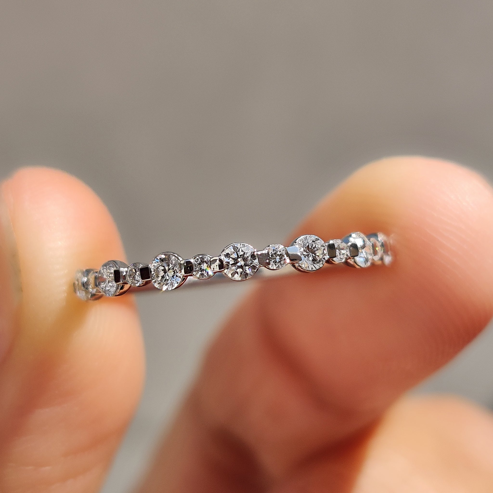Lab Grown Diamond set in a half eternity wedding band.

