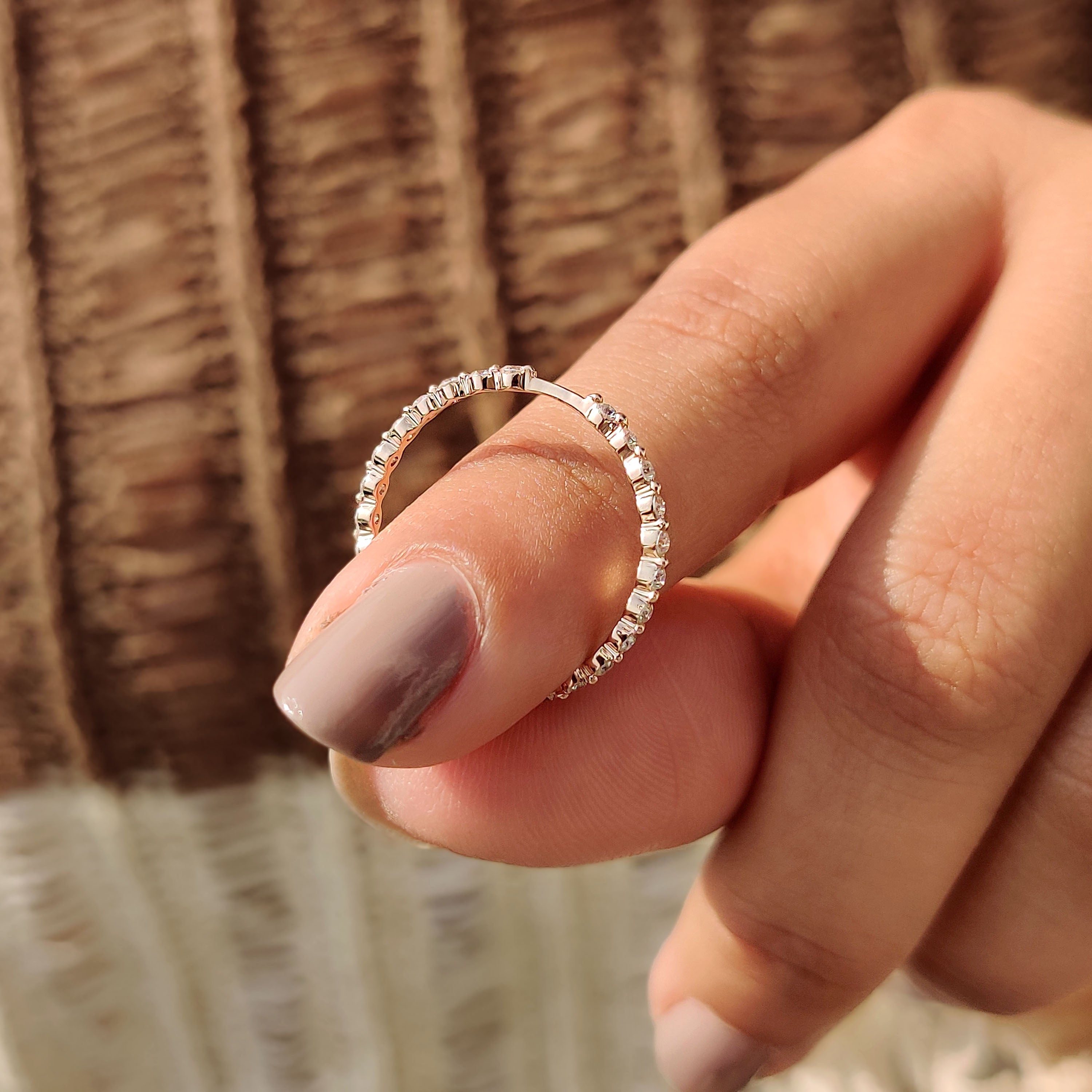 Round cut diamonds set in a stackable wedding band.
