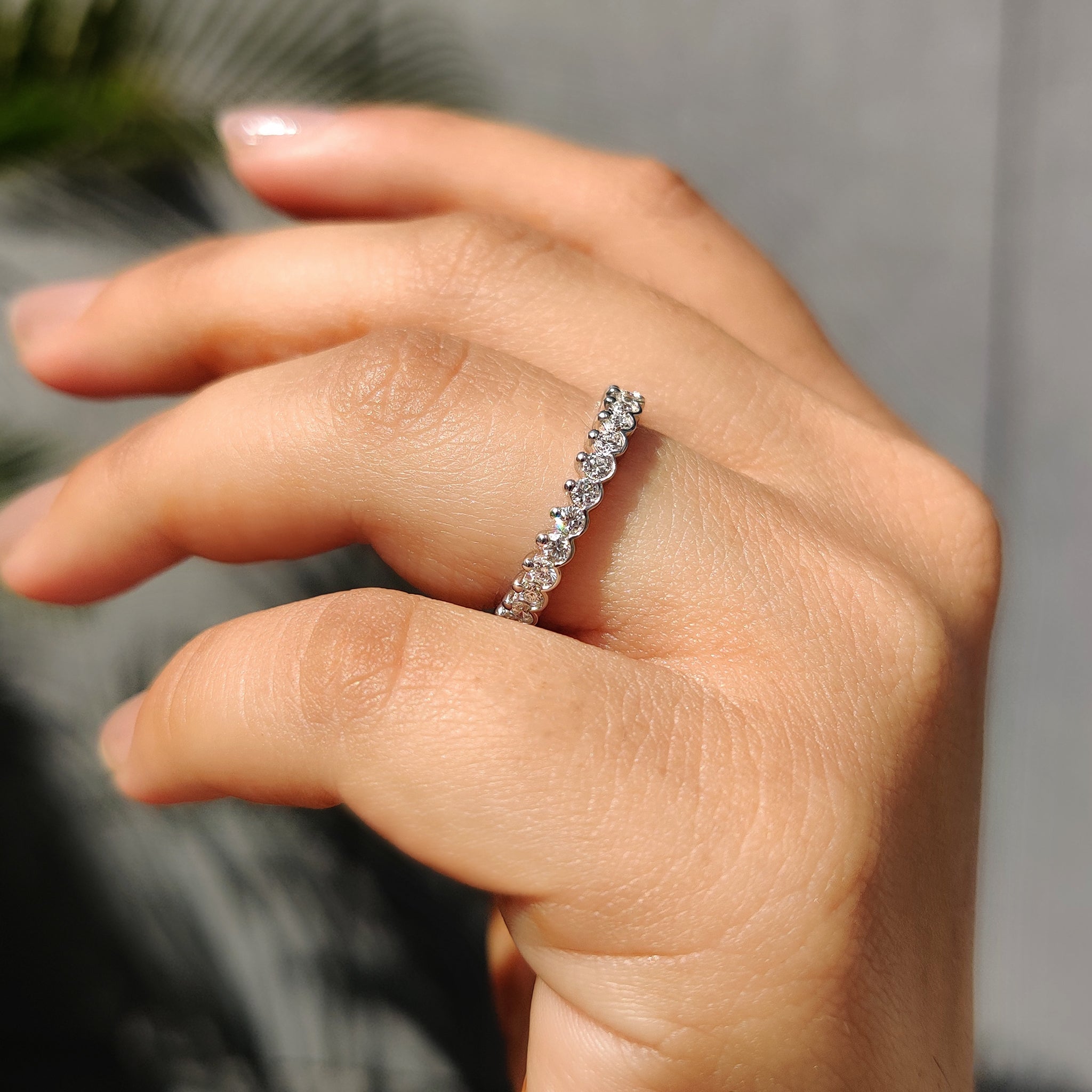 Elegant white gold wedding band with round lab grown diamonds.
