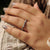 Black moissanite band with handmade design.
