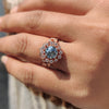Vintage bridal set with a round cut engagement ring and curved wedding band.
