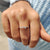 White gold wedding band crafted in a polished finish.