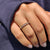Yellow gold band with a round Moissanite center, ideal for a wedding.