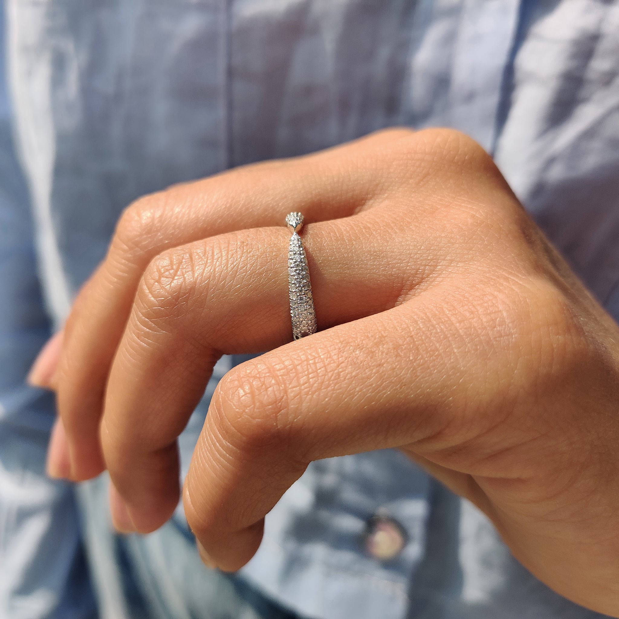 Three side pave band with round cut moissanite, offering brilliance on all three sides.