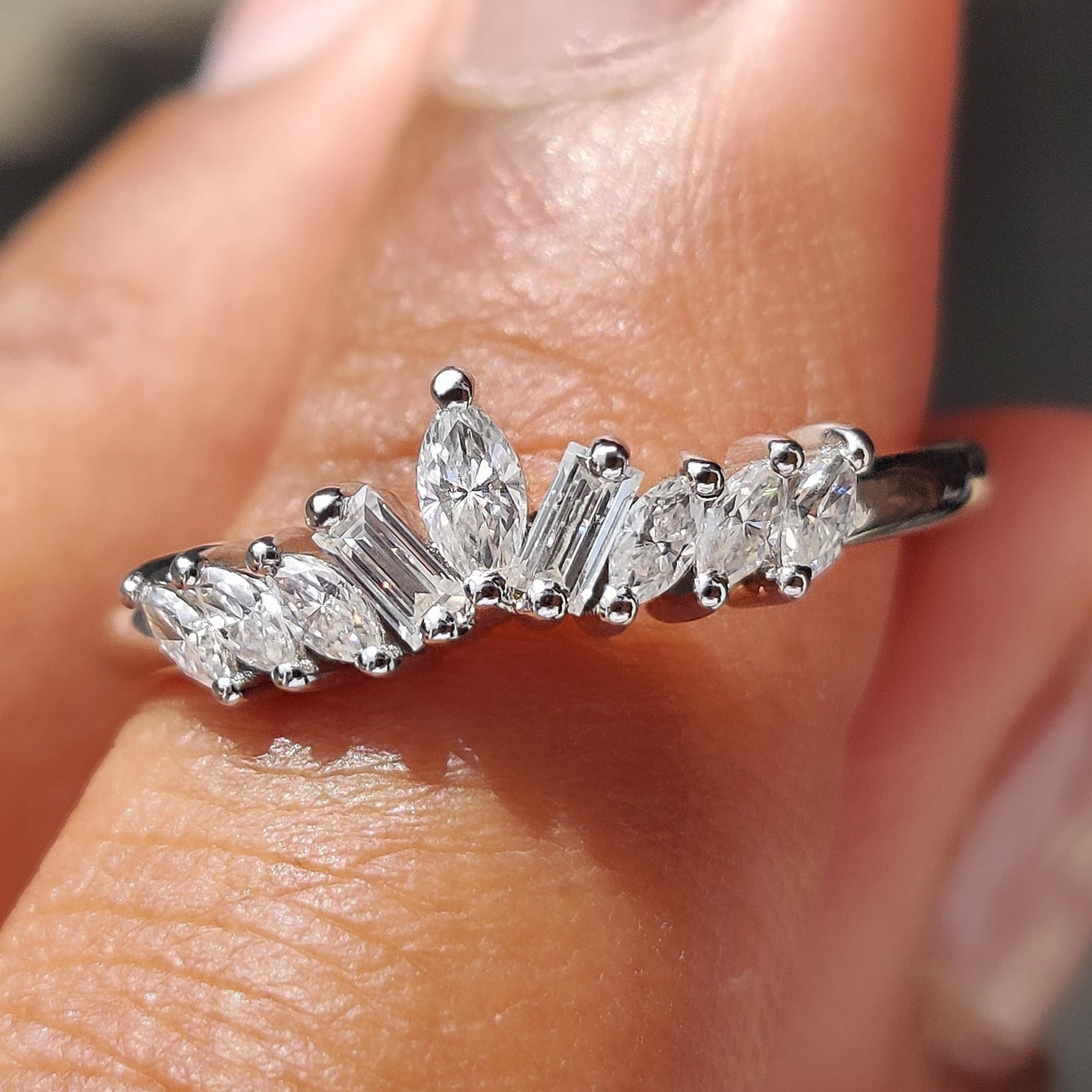 Curved wedding band crafted to complement engagement rings with elegance and style.