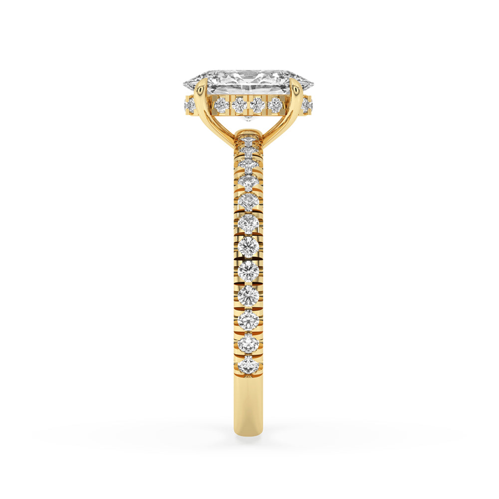 Hidden halo oval engagement ring with pave diamond band for timeless sparkle.