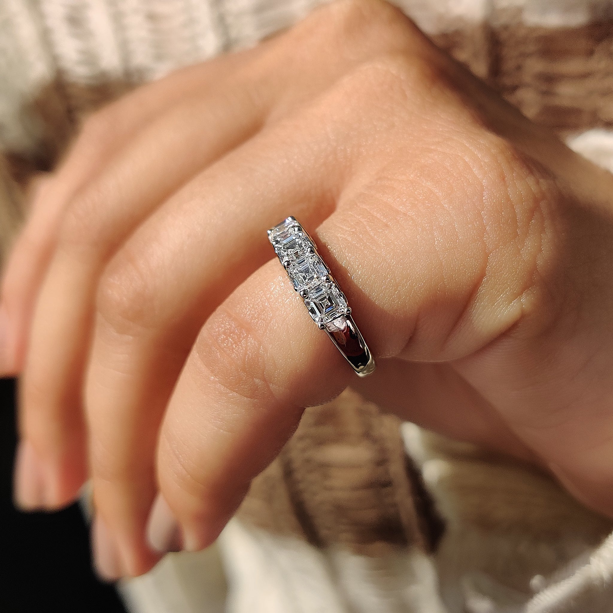 Handmade white gold wedding band featuring Asscher cut lab grown diamonds