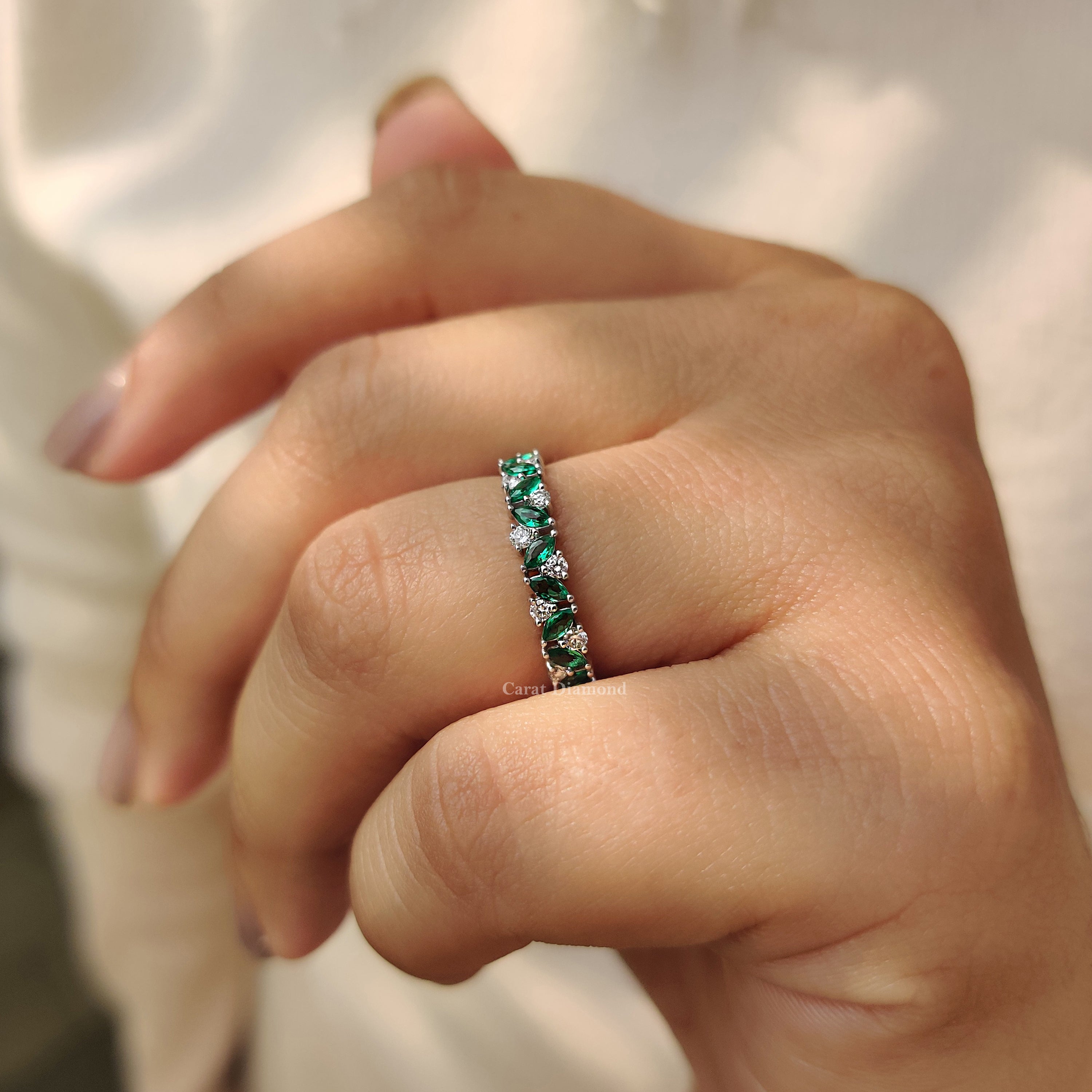 Carat Diamonds wedding band with modern elegance.
