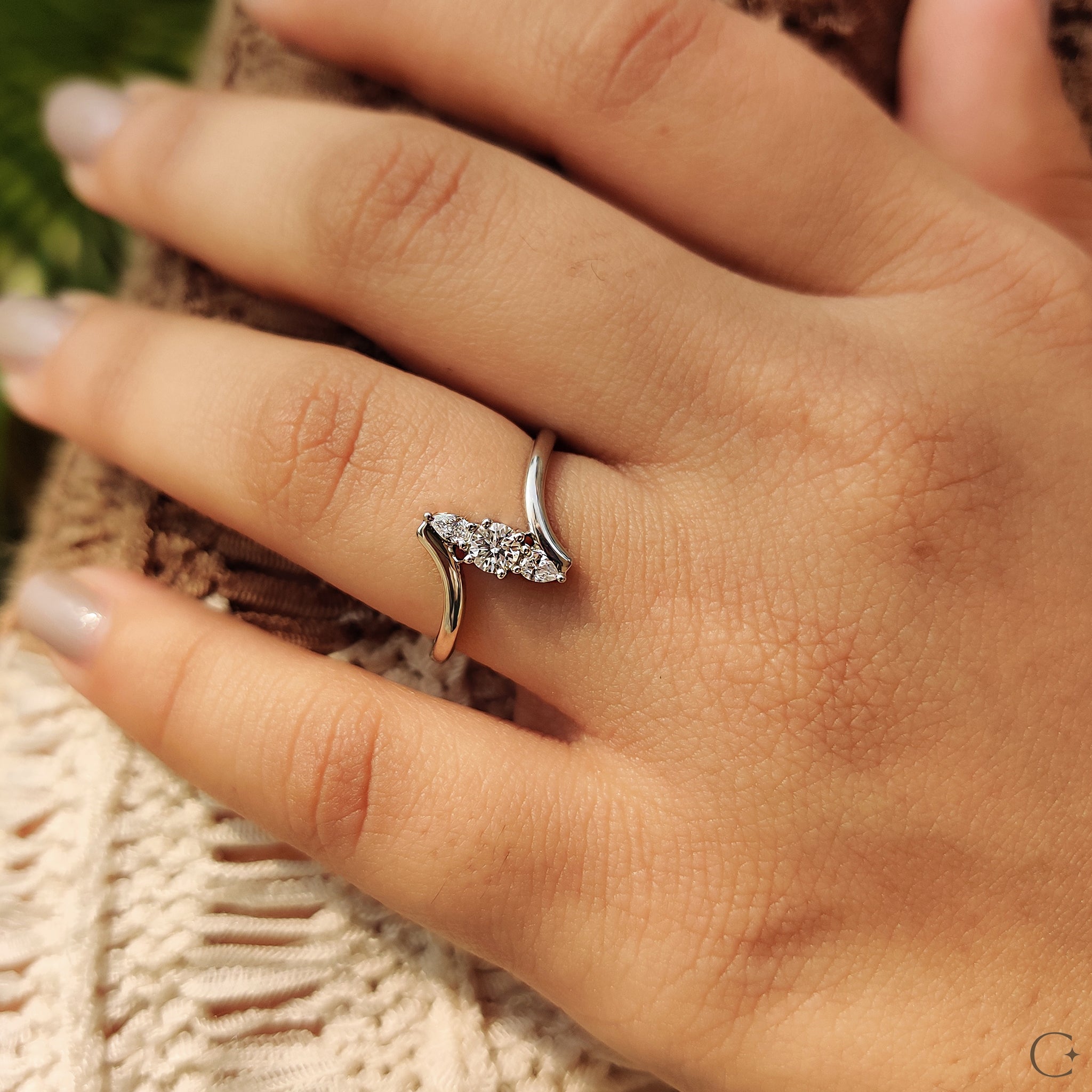 Two pear-shaped diamonds on a beautiful ring.
