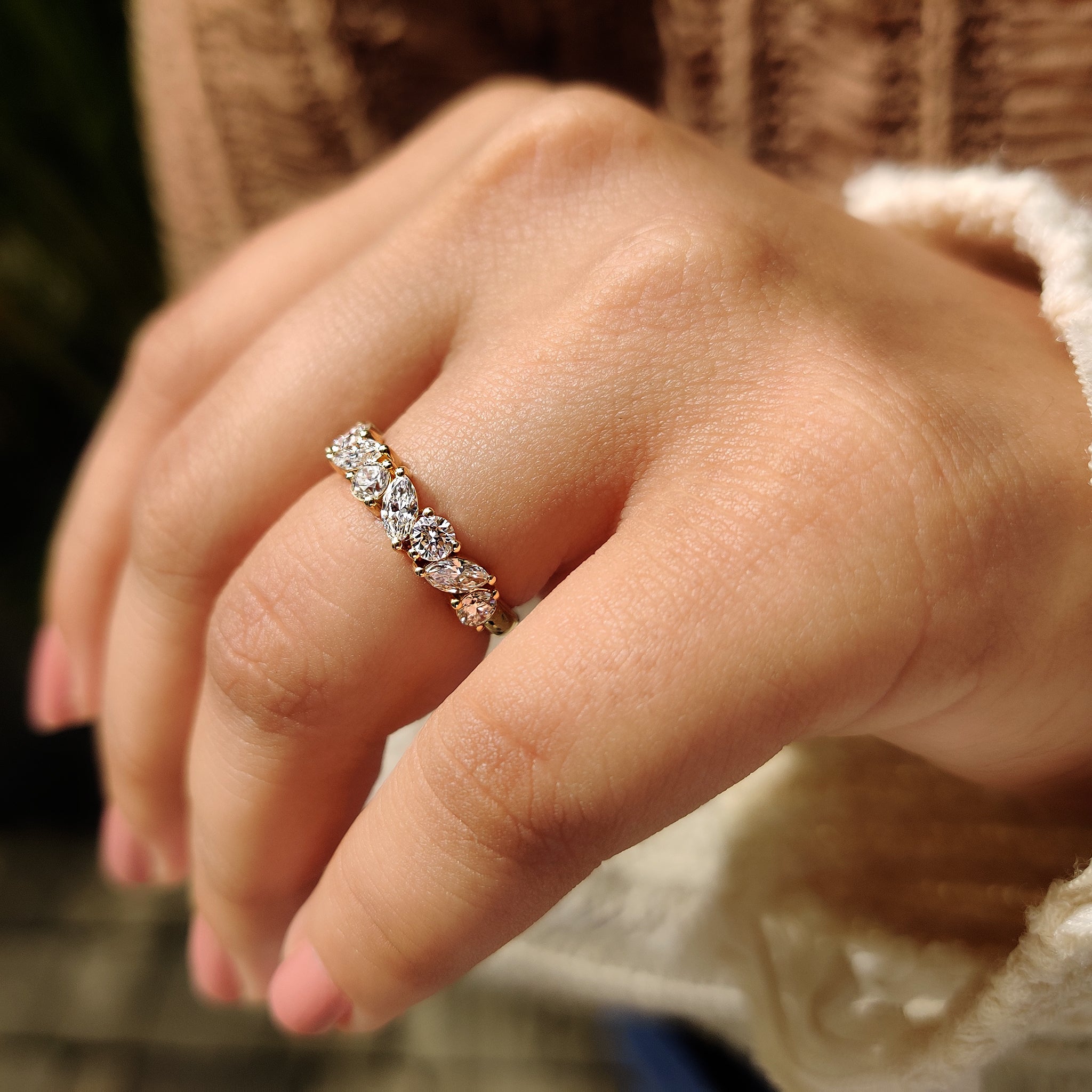 Gold wedding band with round and marquise diamonds