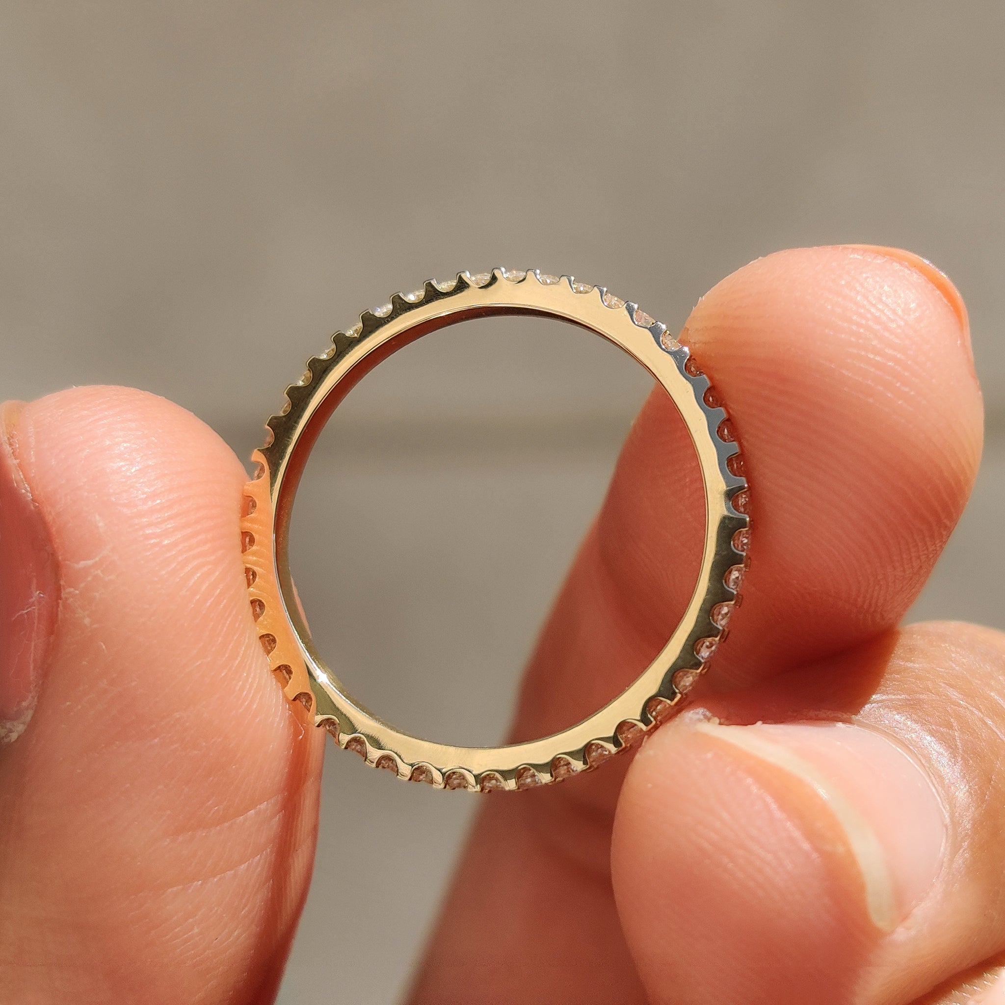 Handmade Jewelry featuring an eternity diamond band.
