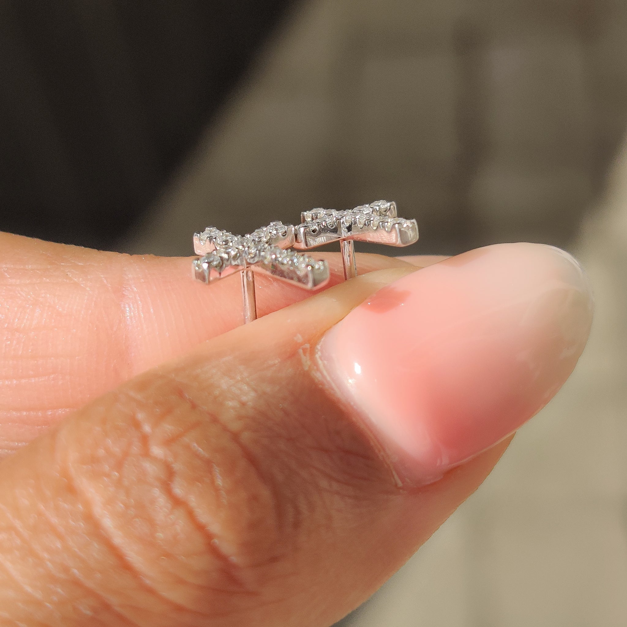 White gold stud earrings with lab grown diamond accents.