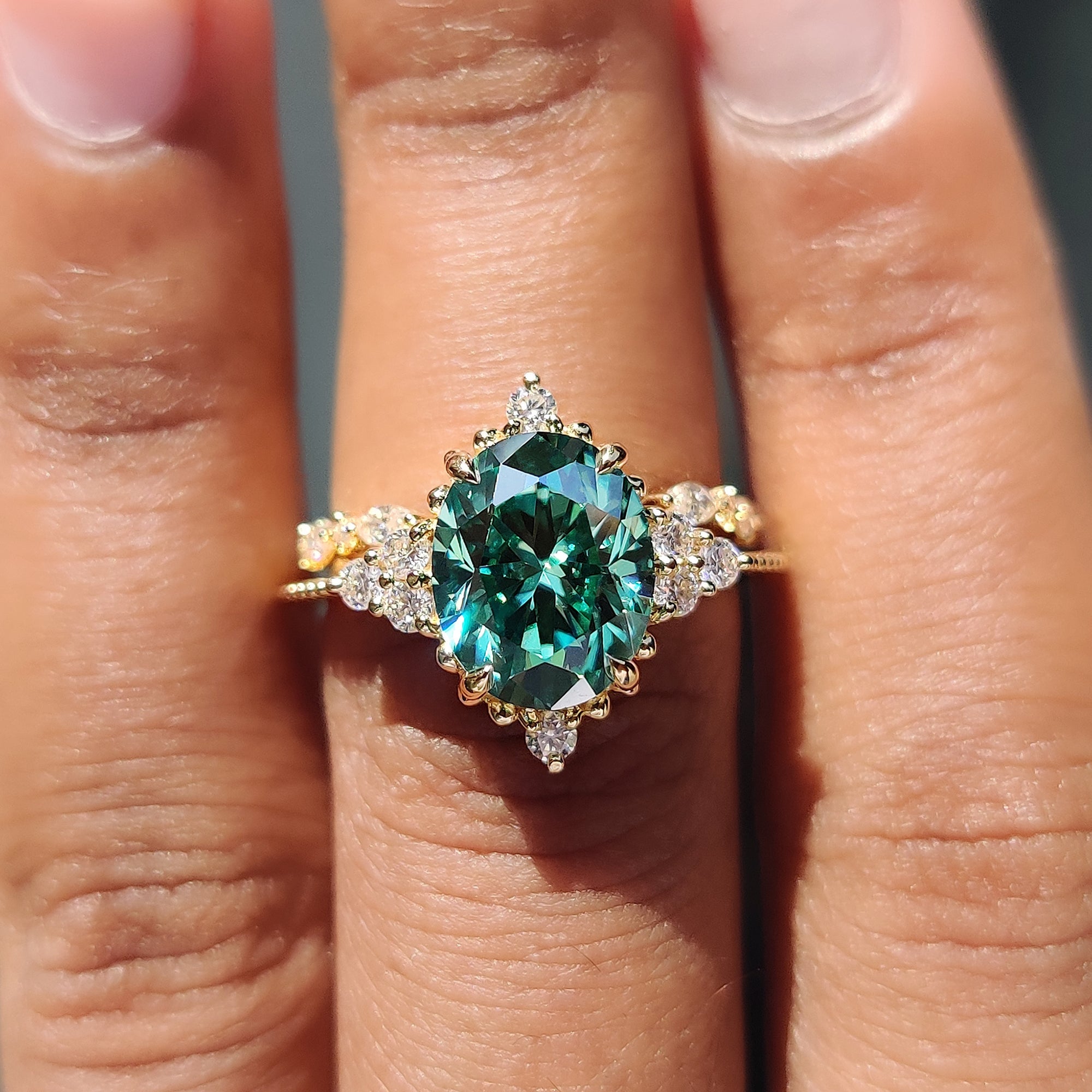 Unique ring design with green stone and marquise cut band.

