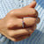 Round wedding band with a smooth circular shape.