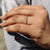 Round cut wedding band made with moissanite stones.