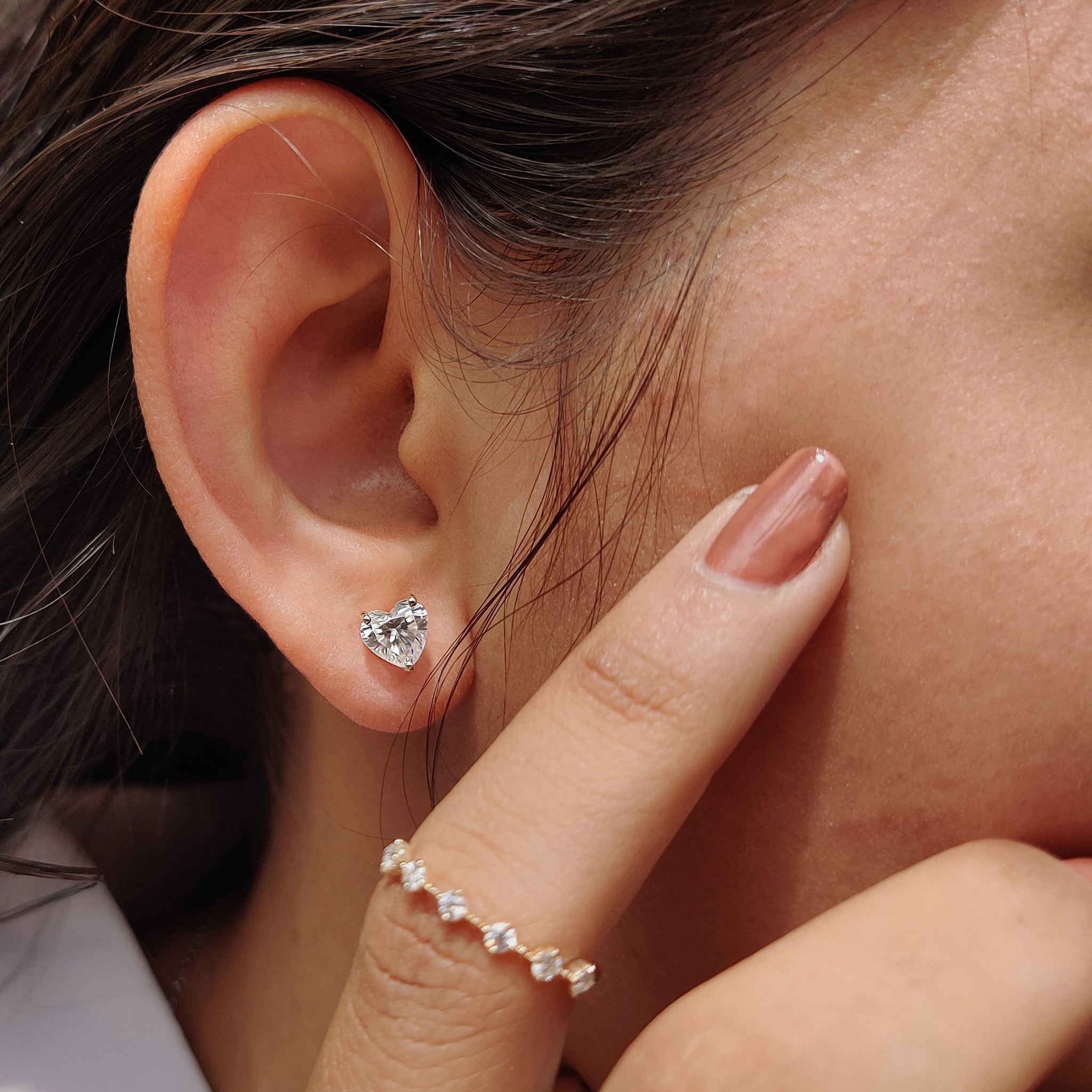 Moissanite stud earrings crafted in Heart cut earrings design with handmade earrings finish.
