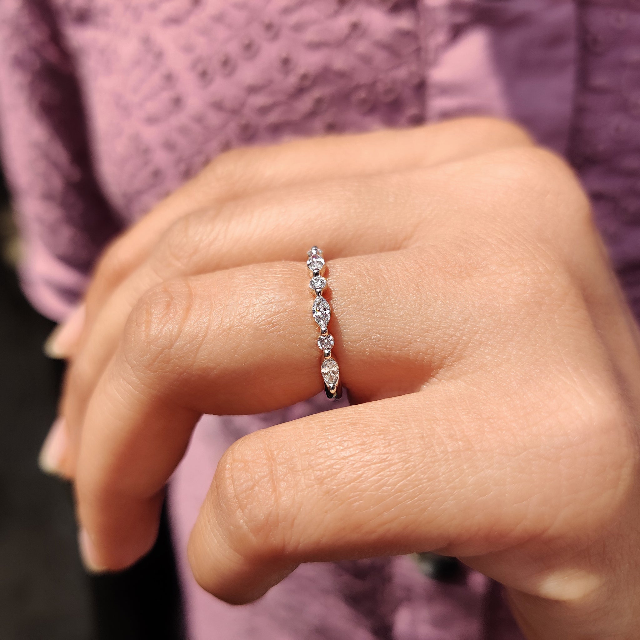 Half eternity band with sparkling diamonds around the band.
