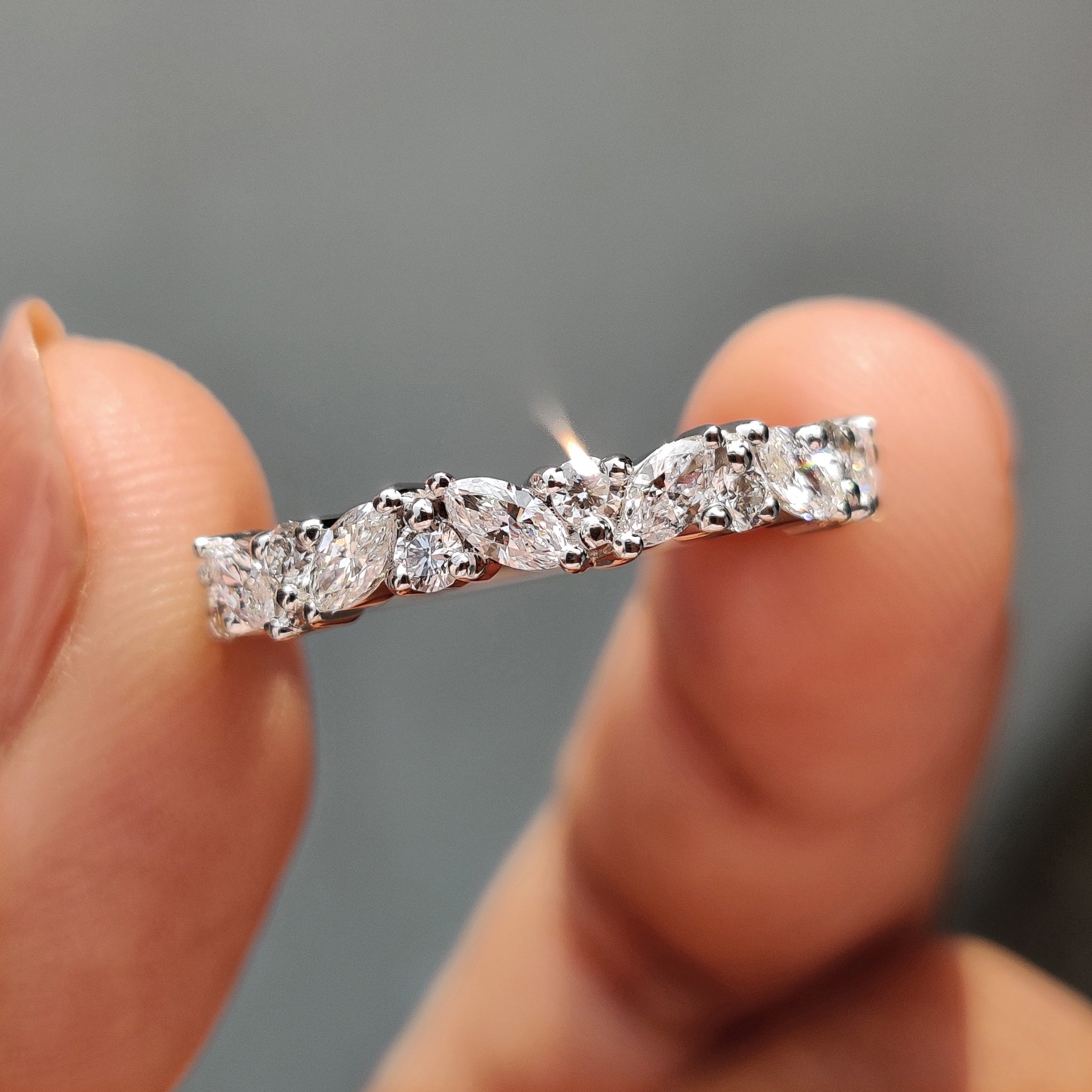 Marquise and round diamond wedding band in white gold.