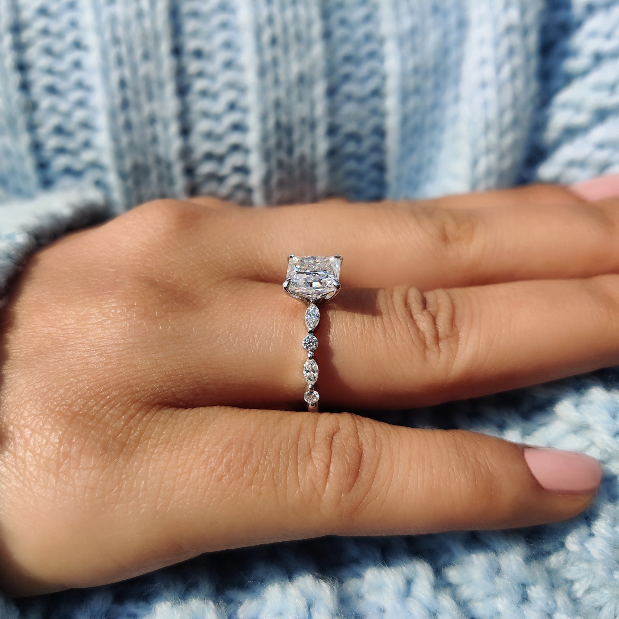 White gold engagement ring shines with soft finish.

