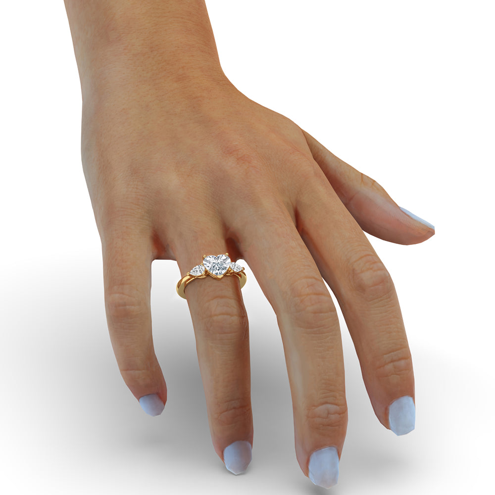 Three stone ring in a 3-prong engagement ring setting, highlighted by a pear-shaped diamond and elegant handmade craftsmanship.
