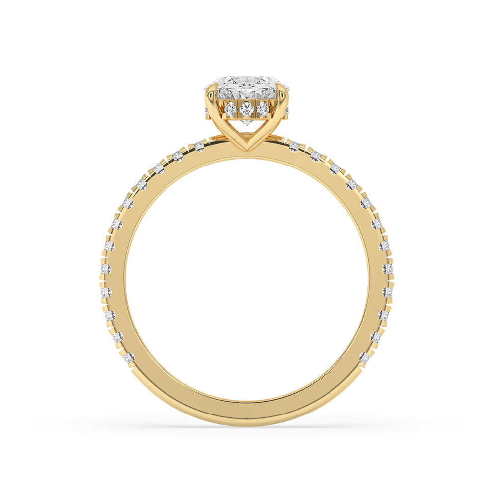 Oval cut diamond ring with a gold pave ring setting and claw setting for durability.