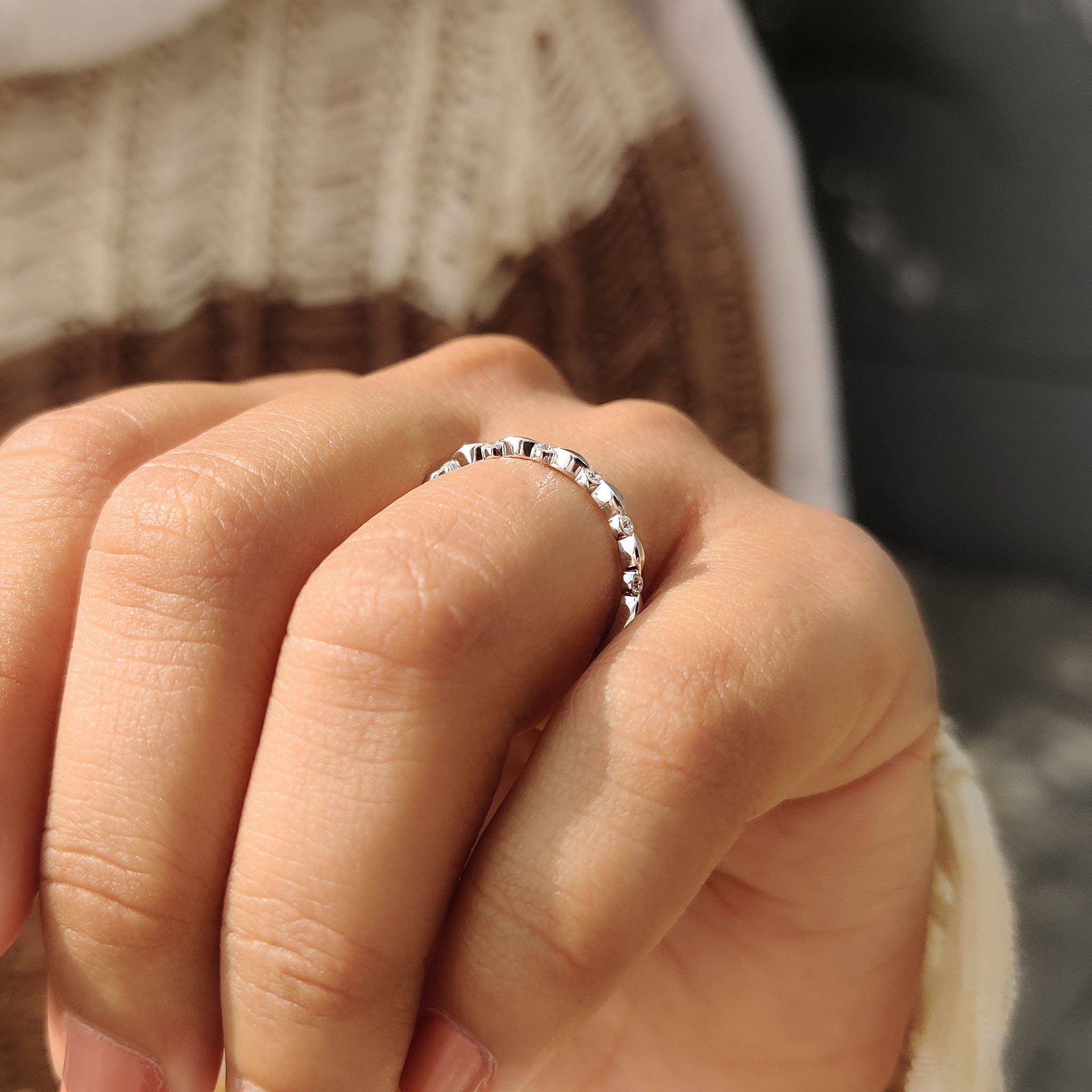 Handmade band with half eternity design and white gold round diamonds.
