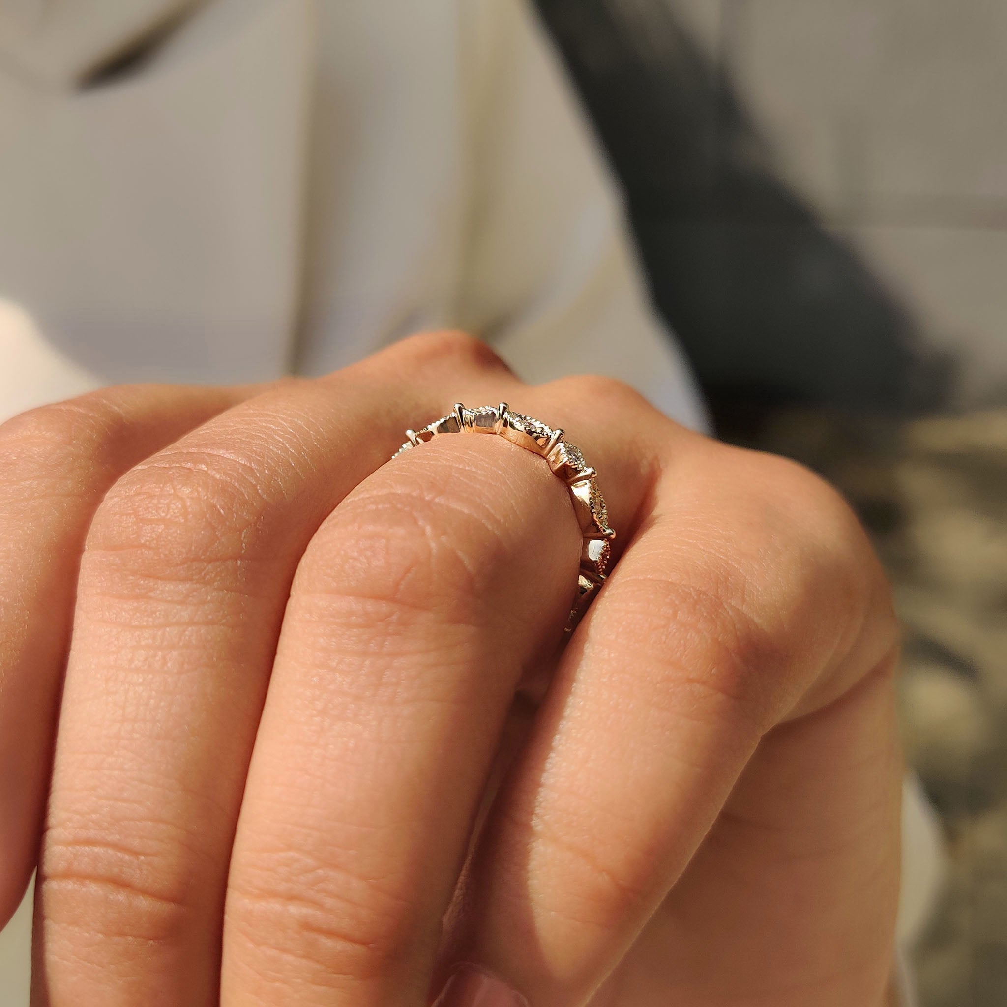 Carat diamonds wedding band with marquise shape outline and yellow gold band.
