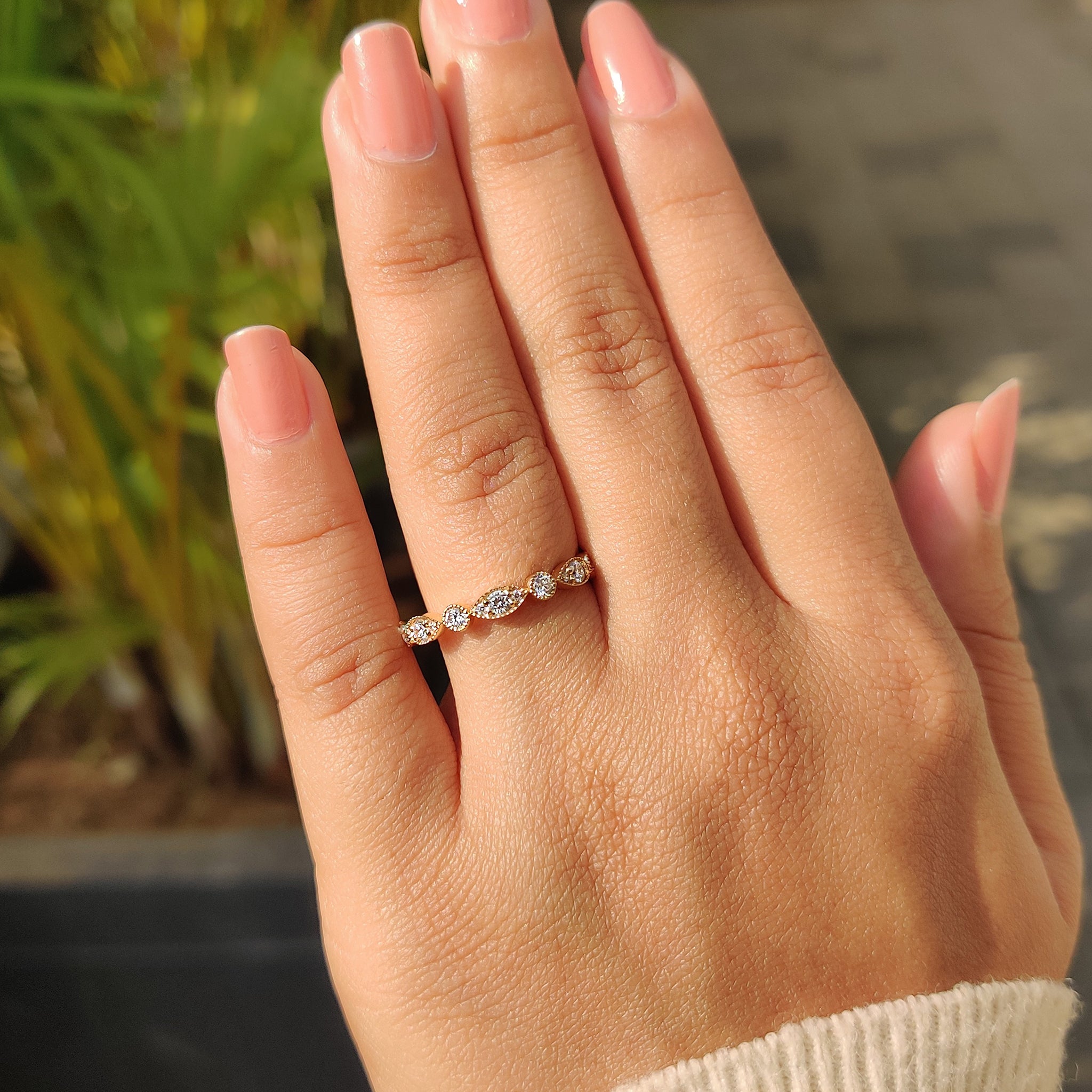Lab grown diamond ring displayed with a minimalist background.
