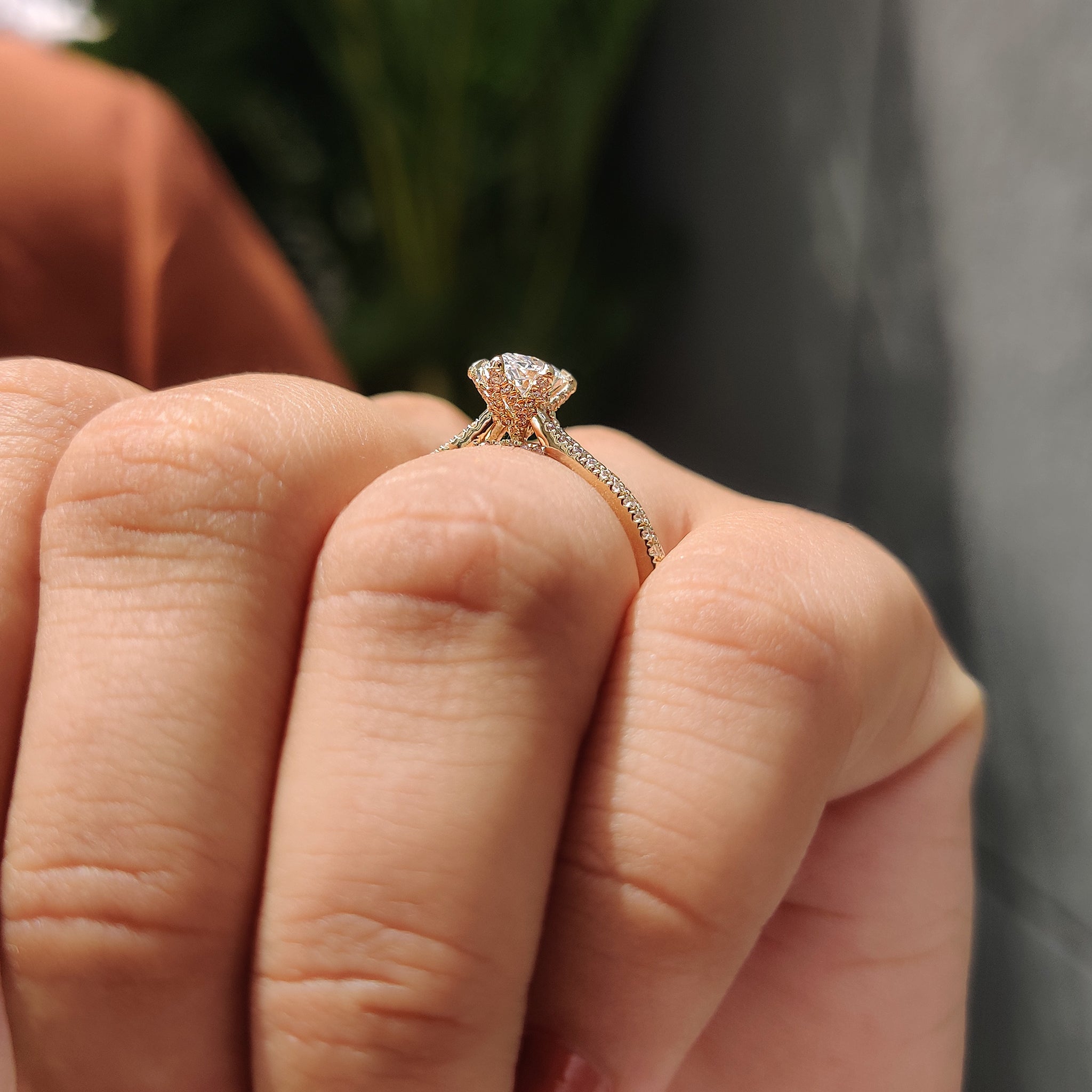 Bridge accent engagement ring with six claw prong setting.