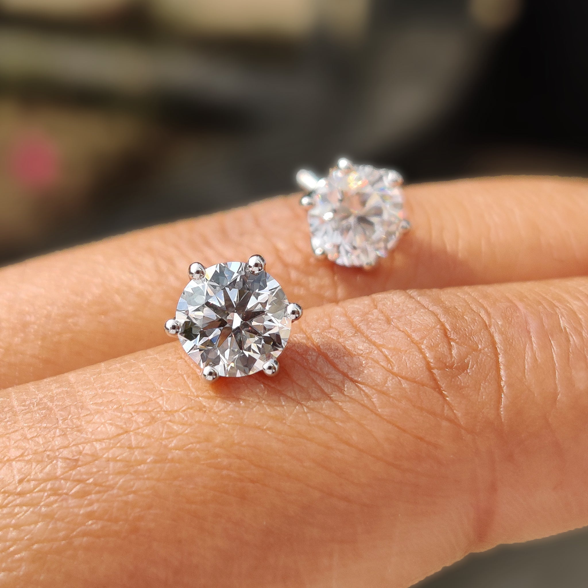 Round cut diamond earrings set in white gold.