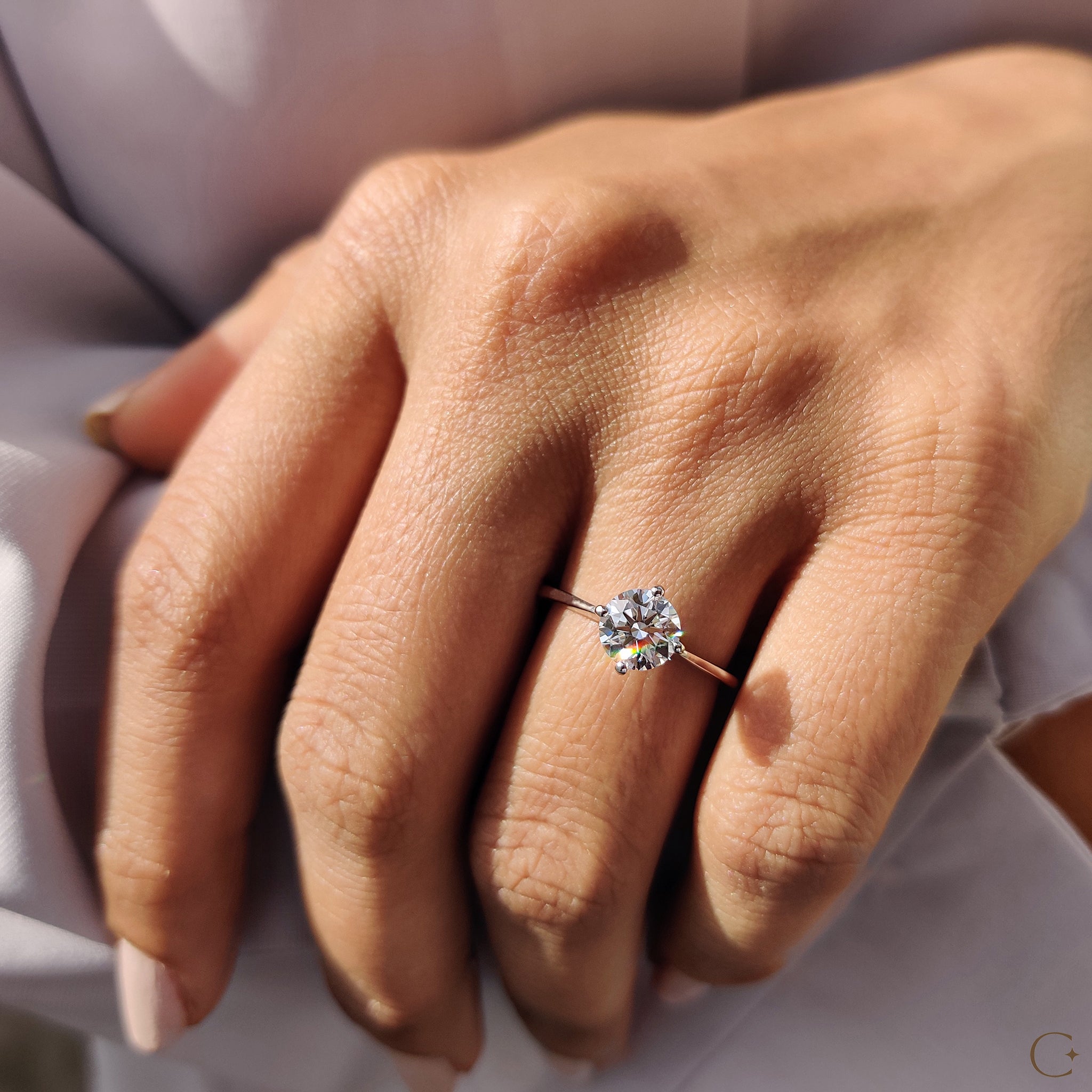 Elegant tapered shank engagement ring with sleek design.

