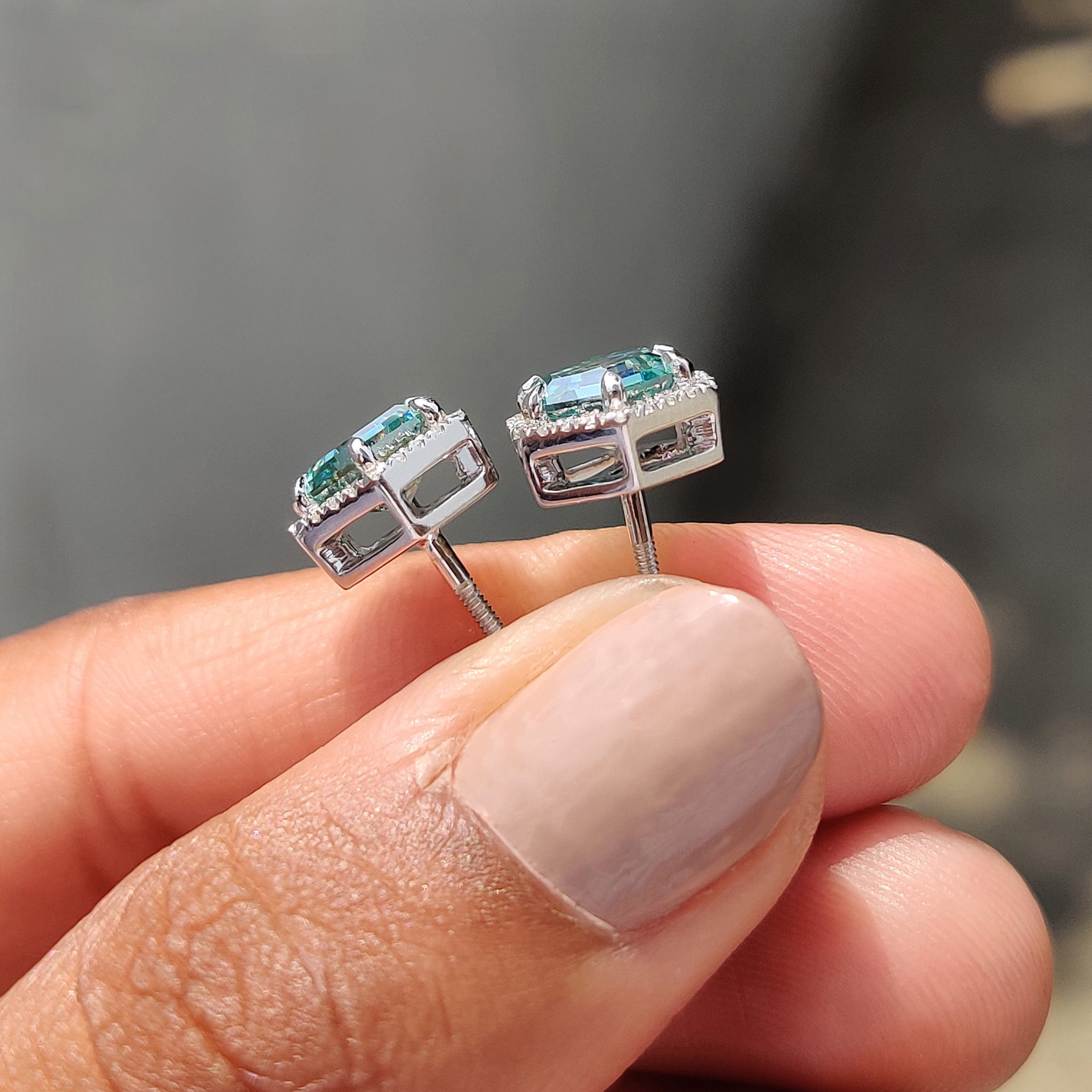 Round cut halo earrings made with prong settings earrings for carat Diamonds earrings collection.
