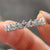 Buy wedding band featuring moissanite in half eternity style, crafted for comfort and shine.