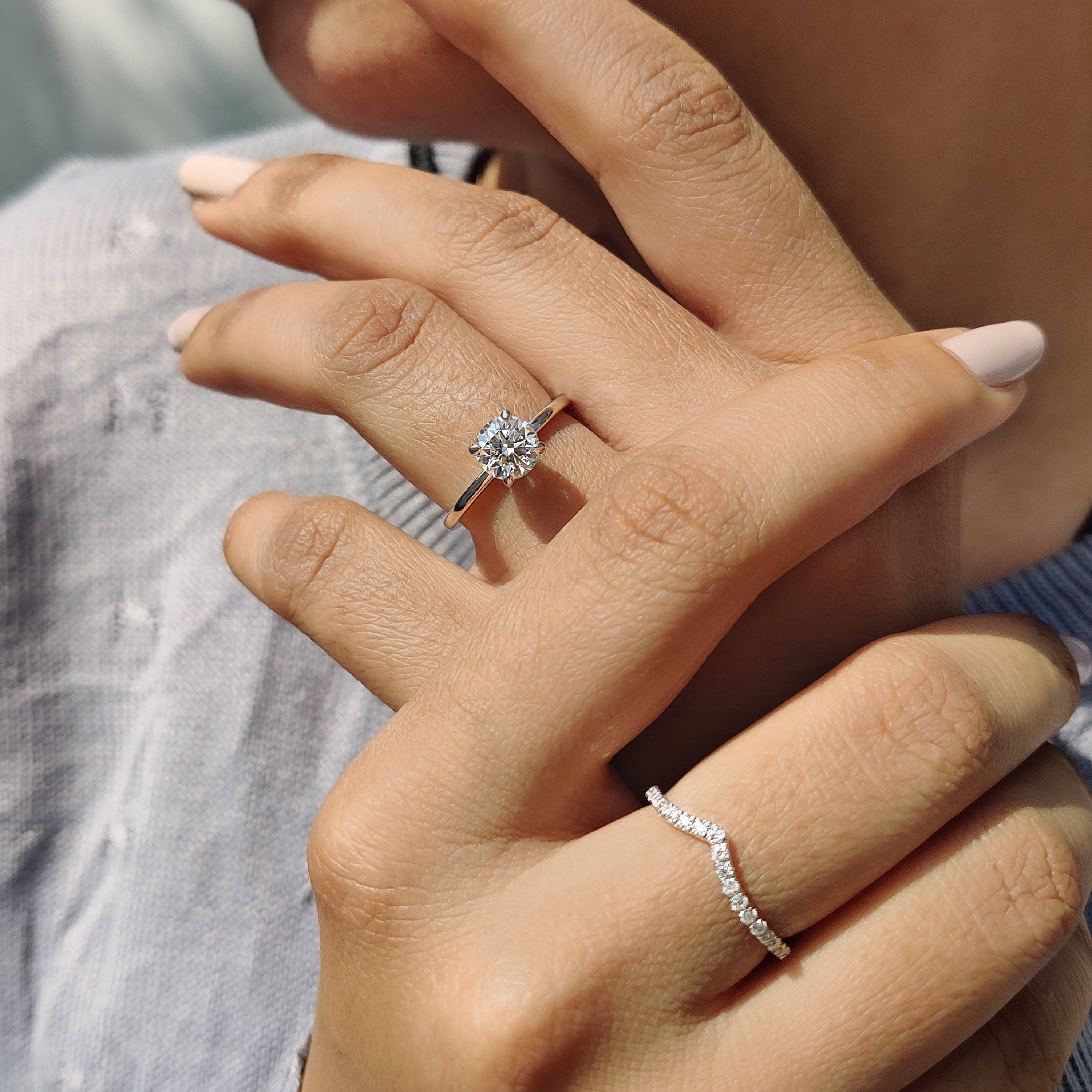 Handmade bridal set crafted in white gold with a round cut moissanite centerpiece.
