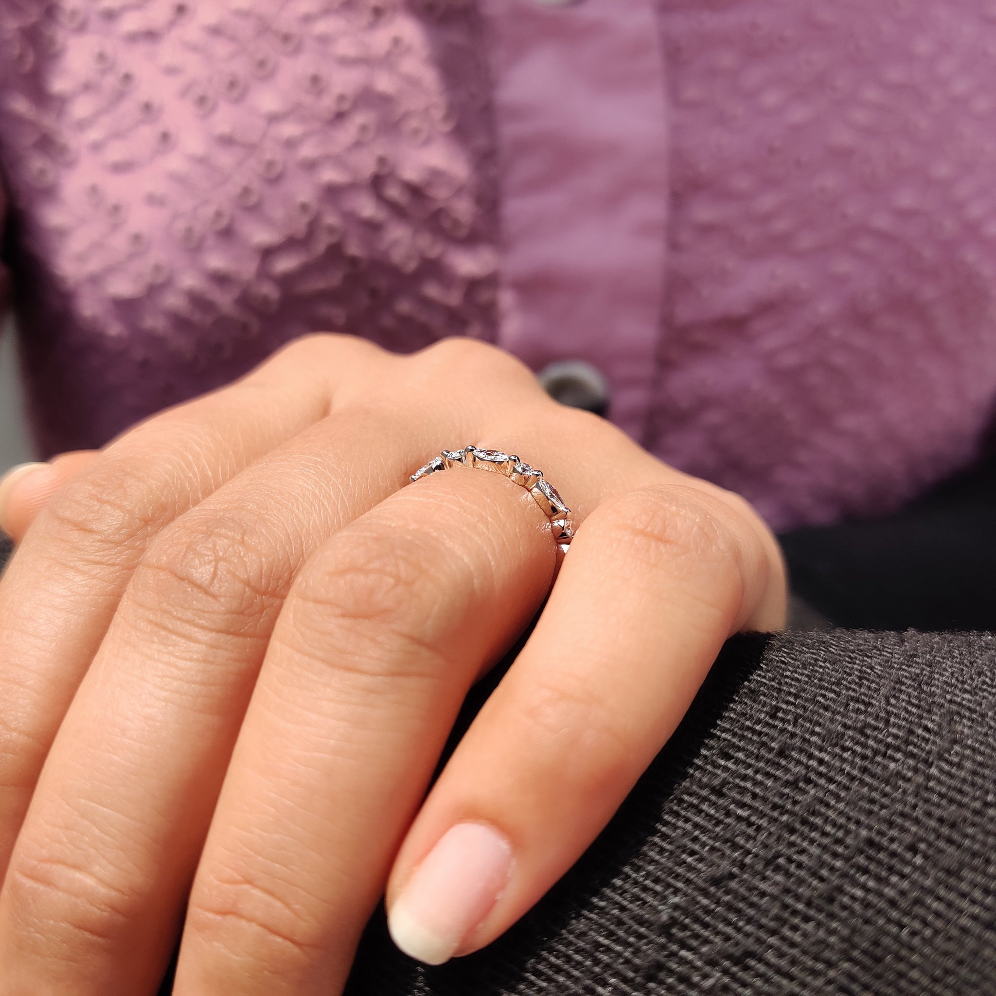 Shared prong wedding band highlighting a sparkling diamond arrangement.
